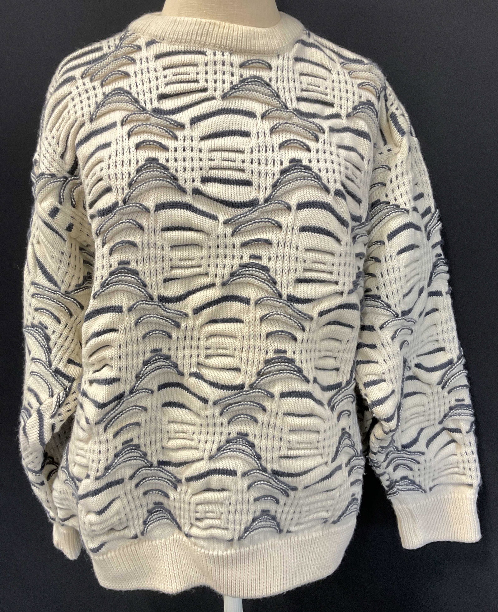 Vintage COOGI Knit Sweater, Australia: Vintage COOGI Knit Sweater. Label reads ‘COOGI Australia, Pure Wool, size Medium, Made in australia.’ Minimal surface wear to piece. Minor discoloration to neck. Torso length measures approx 21 in