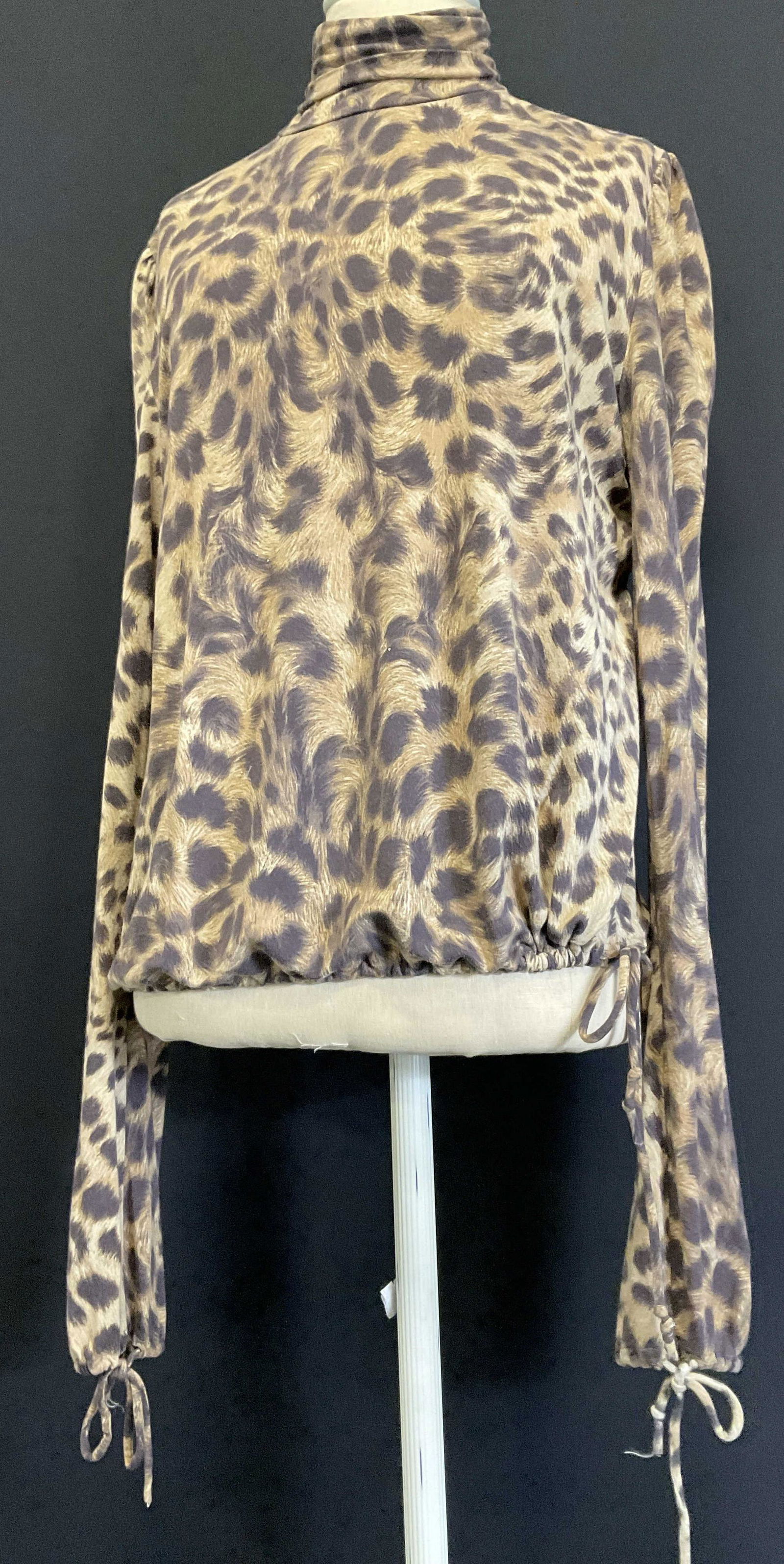 ETRO Milano Leopard Print Turtle Neck, Italy: ETRO Milano Leopard Print Turtle Neck. Label reads ‘ ETRO Milano, size 46, Made in Italy, 90% Viscose, 10% Elastane. Minimal wear to piece. Cinch to waist and ends of sleeves. Luxery wear, leopard p