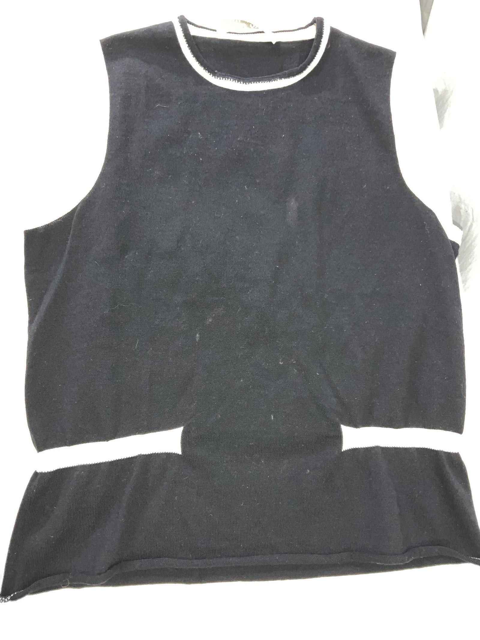 MIU MIU WOOL SLEEVELESS TANK SWEATER, Italy: Vintage MIU MIU BLACK WOOD SLEEVELESS TANK SWEATER WITH WHITE TRIM. LABEL READS MADE IN ITALY, SIZE Medium. Property of Manhattan, NY estate SIGNED MIU MIU, WOOL TANK SWEATER, casual wear, DESIGNER kn