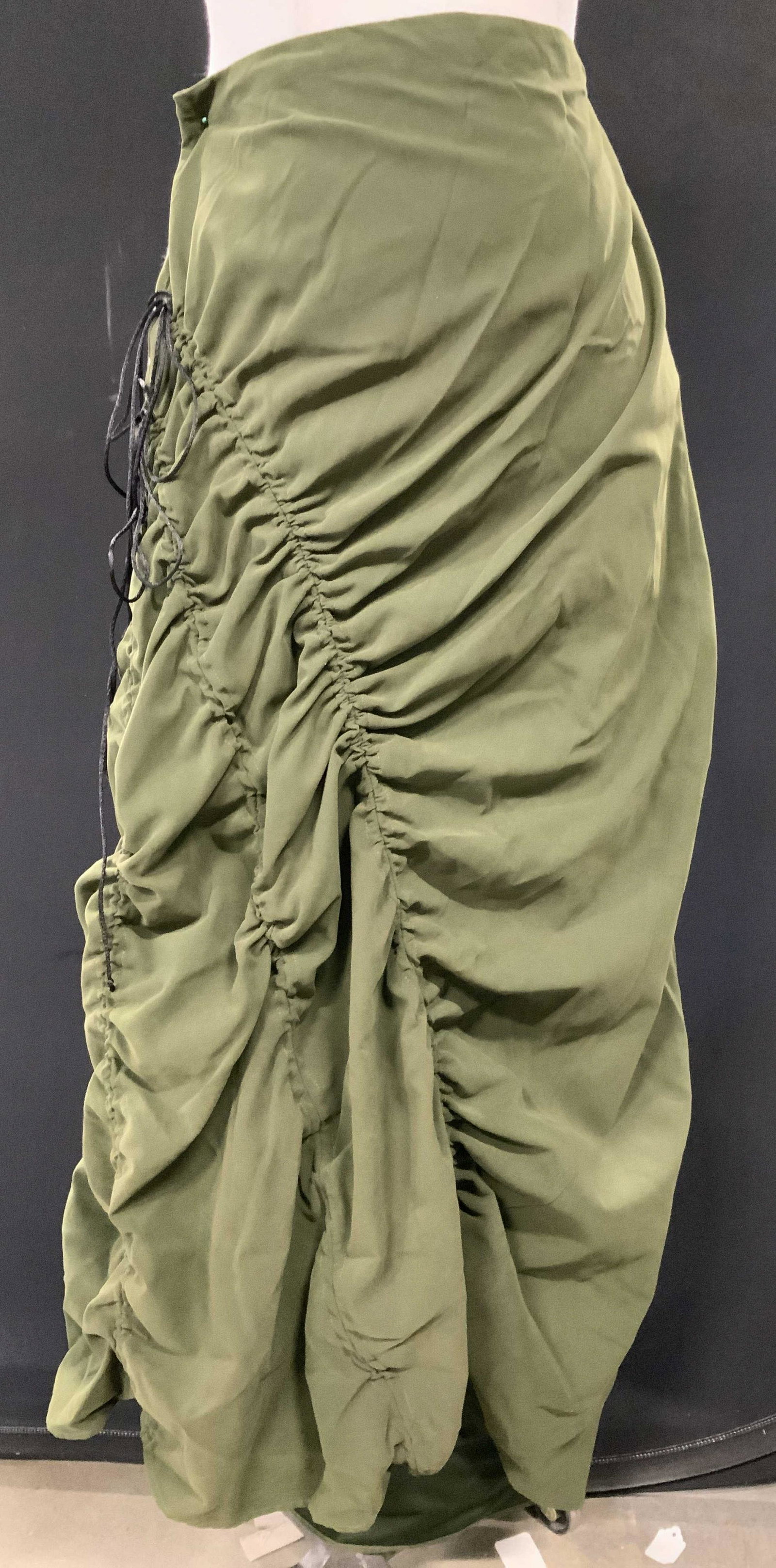 ILLIG Moss Green Bohemian Long Skirt, New: Size Medium polyester skirt, exterior feels like a thin suede. Accented with tassels on the side and rouching. Waist 30 in. Length 36 in. Long. Moss green toned. bohemian fashion, skirt, casual wear,