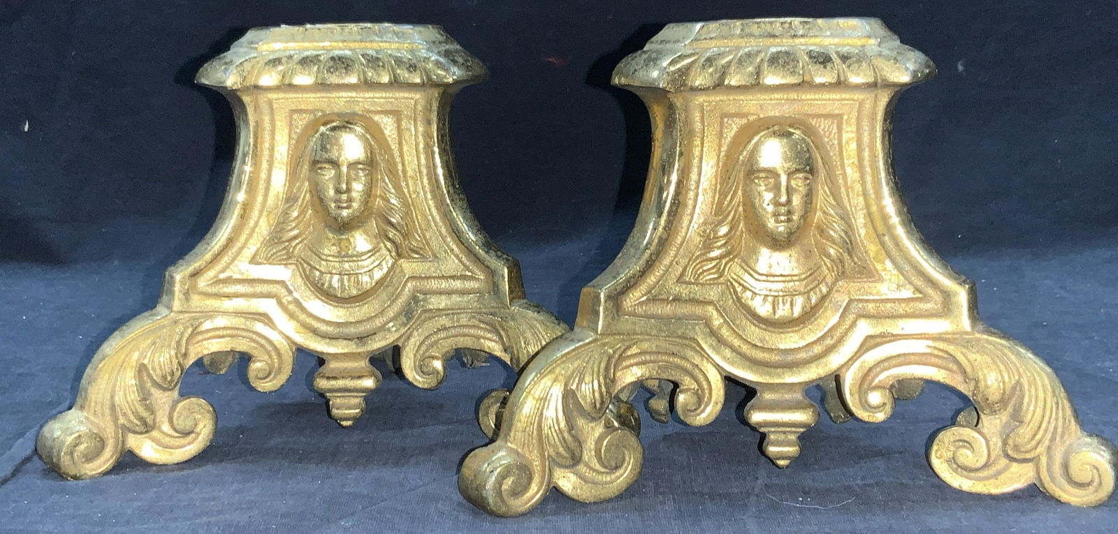 Pair Vintage Brass Painted Scroll Ornate Bases: Pair of vintage brass cast painted three footed bases. Each has three sides depicting the aging face of a long haired man. Scroll designed feet . Approximately 4.75 inches tall. Vintage brass cast met