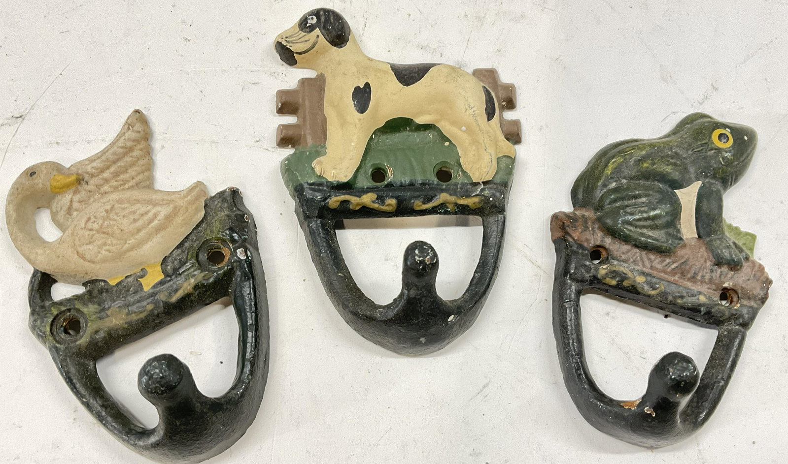 Iron Antique Animal Wall Hooks: Iron Antique Animal Wall Hooks. Dog, Duck and frog motif. Measures 4 x 3 inches. Surface wear to piece consistent with age and use. Iron wall hooks, antique pieces, animal wall hooks, wall decor, chil
