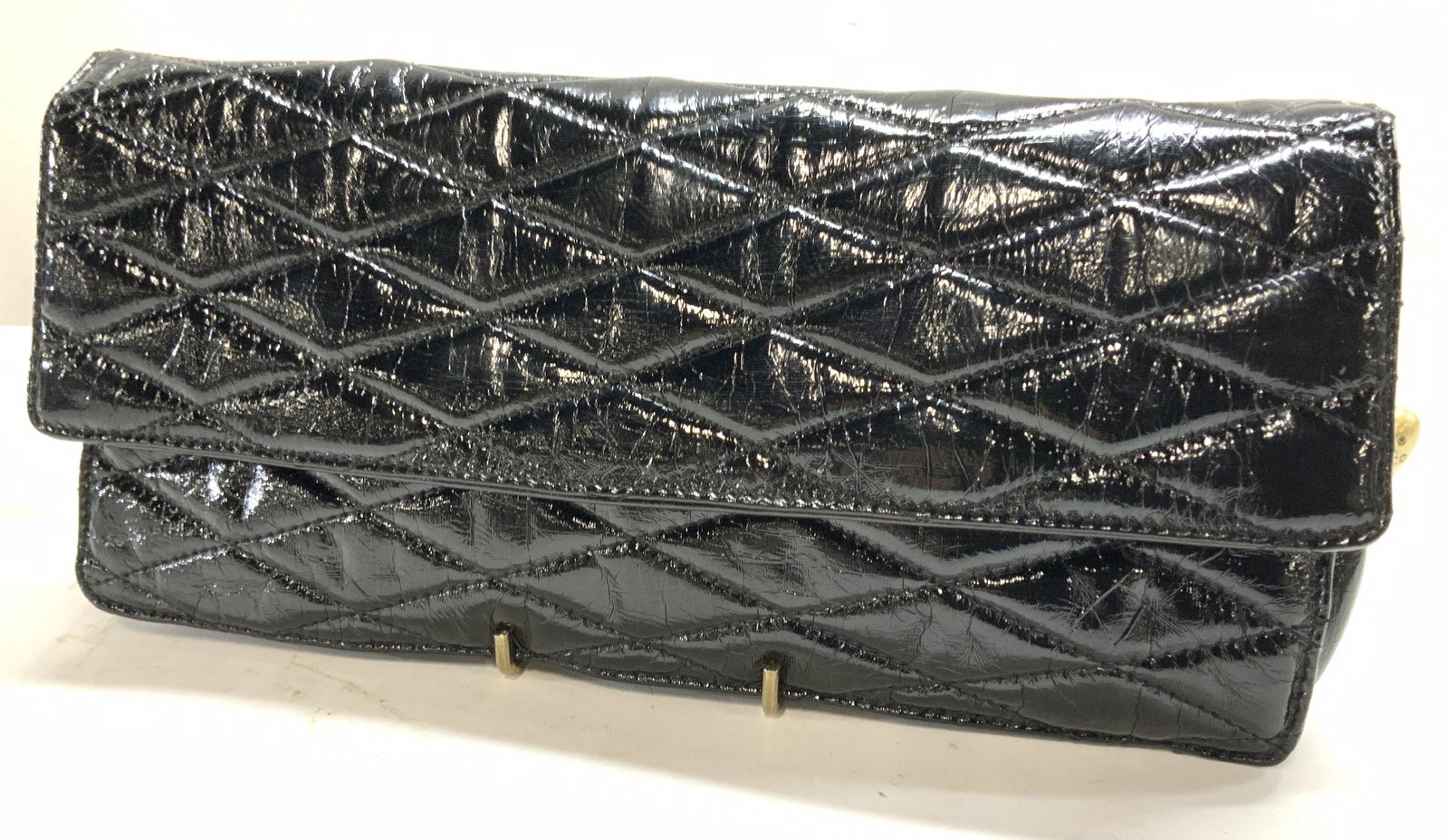 Melie Bianco Sgn Clutch, Red Duster Bag, 2: Signed Melie Bianco black faux leather clutch , quilted exterior, snap and zipper closure. Interior is a polka dot print. Clean inside and out, light wear on a corner. Bag measures 13 x 7 in. Addition