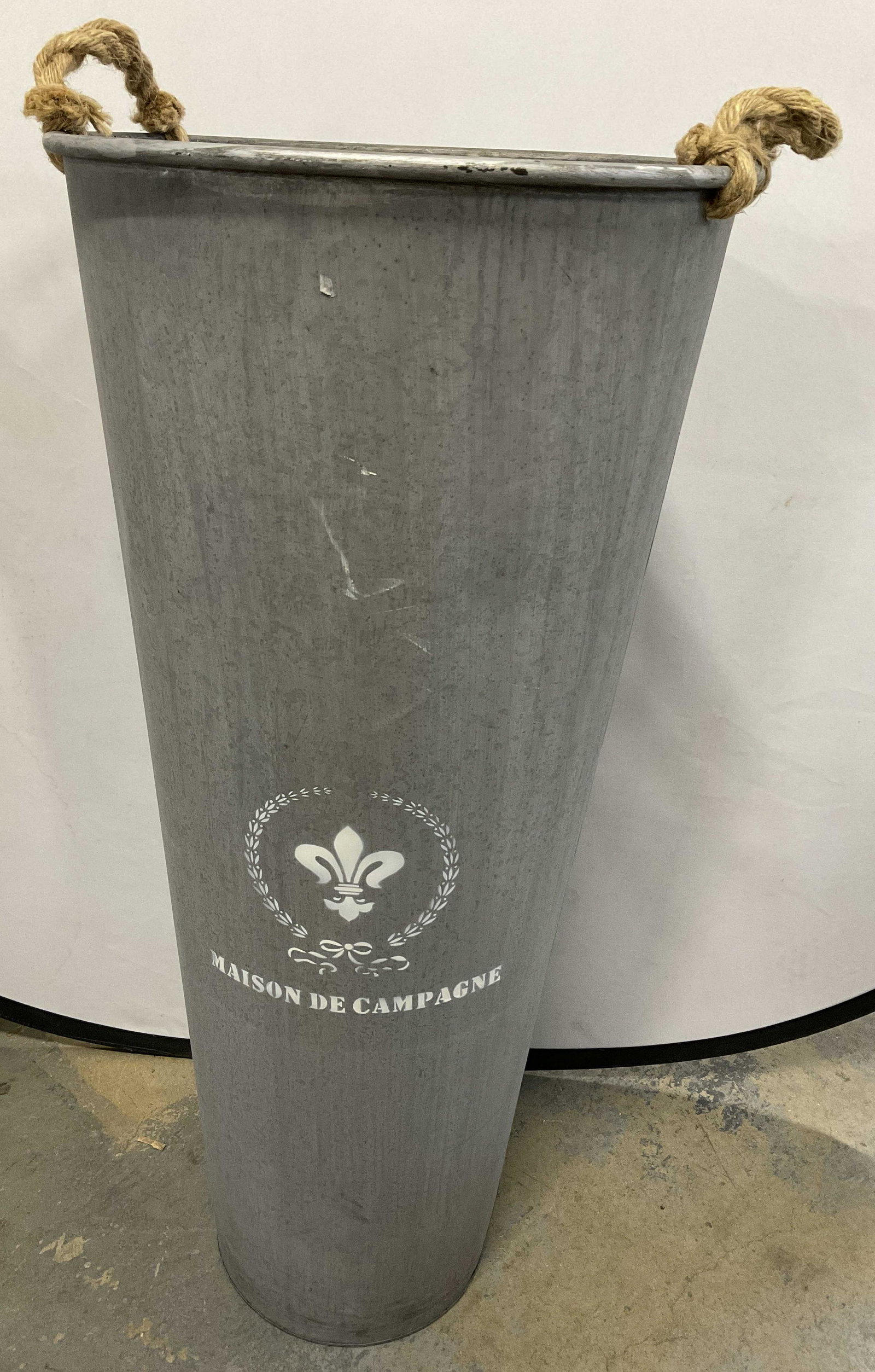 XL Maison De Campagne Metal Can: Measures approx 35.5 x 16 inches. XL Maison De Campagne Metal Can. Hemp rope handles to piece. Surface wear is consistent with age and use. Patio decor, maison de campagne, Metal can, patio use, garde