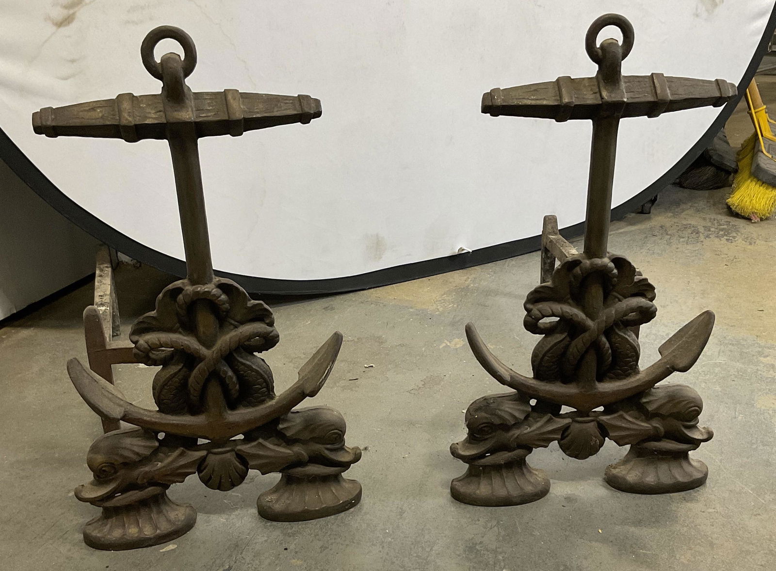 Vintage Anchor Andirons: Vintage anchor andirons for fire place. Anchor detail with fish detail to pieces. Measures approx 16.5H x 9.5W x 20L inches surface wear to piece consistent with age and use. 11B Andirons, fireplace a