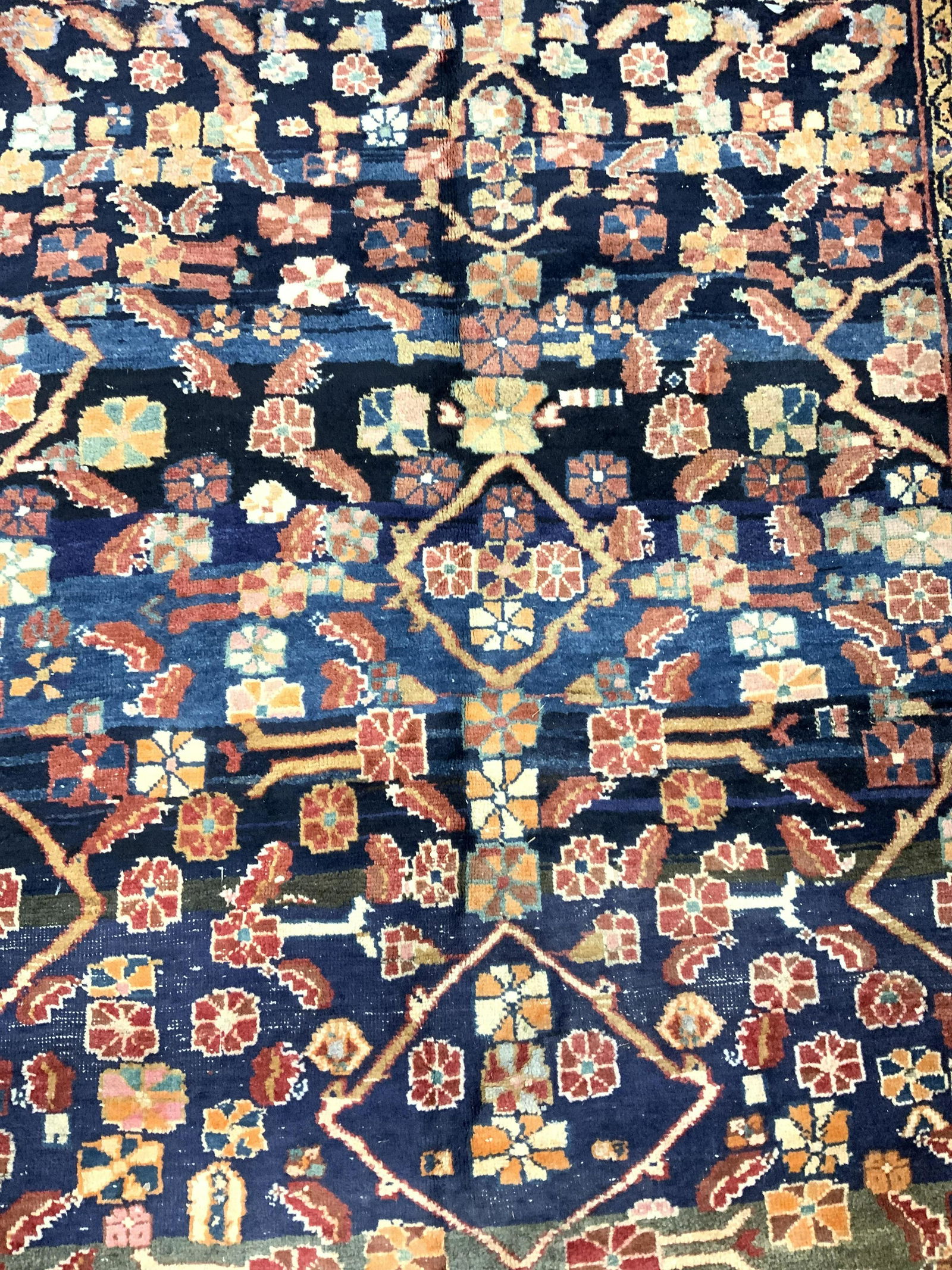 Vintage Handmade Persian Wool Area Rug: Rug is vintage possibly antique. Piece is handmade. Rug appears to be Persian. Piece has intricate multi toned floral, leaf & geometric detail. Rug measures approx 99 inches long 60 inches wide. Rug,
