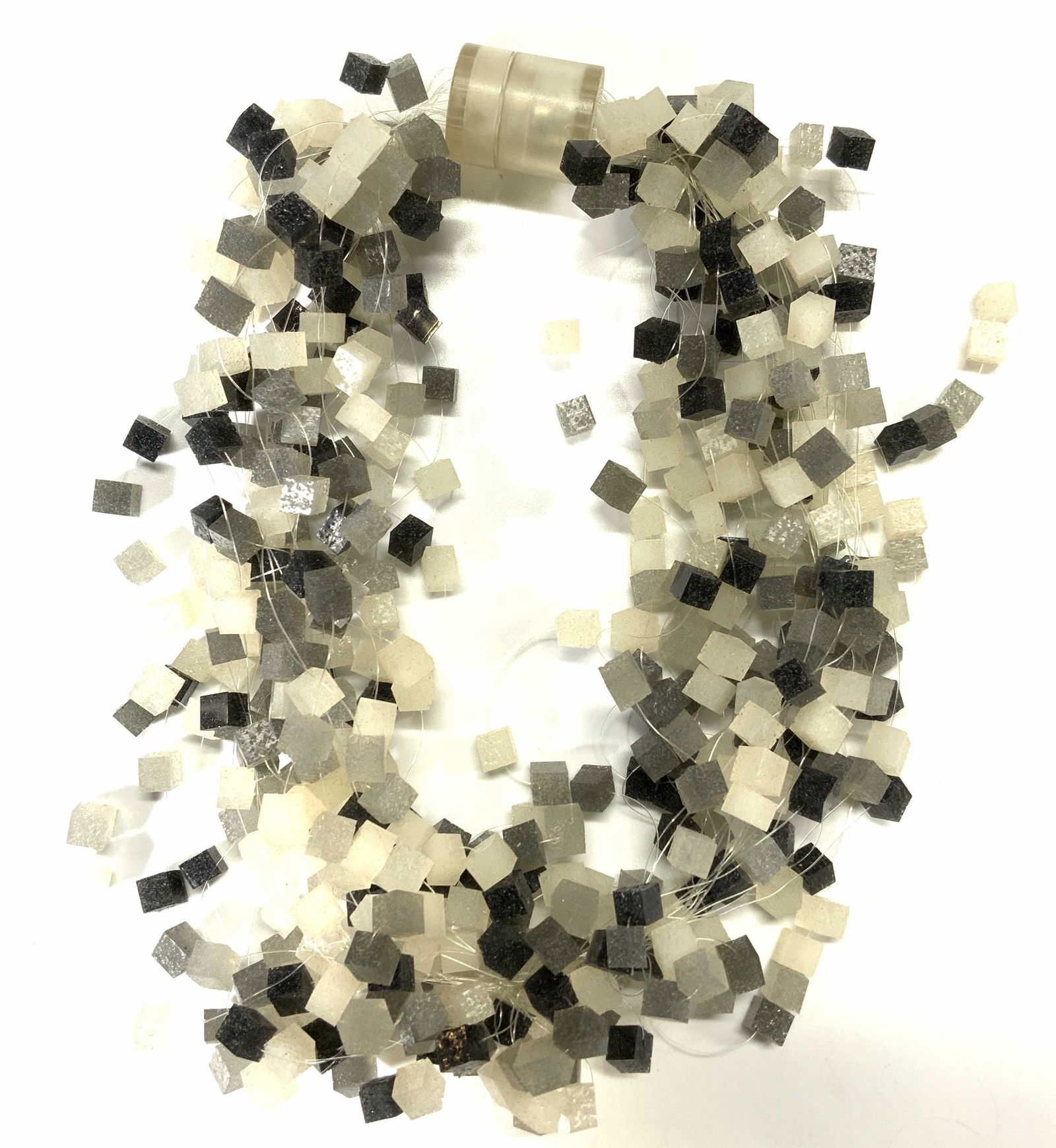 SWATCH BIJOUX Vtg Silicon Choker Necklace: Vintage Swatch Bijoux Silicon choker necklace with cubes in hues of white, gray, and black. Magnetic clasp. Designer trademark to clasp. Measures approx. 14.5 inches long. Wear consistent with exposur
