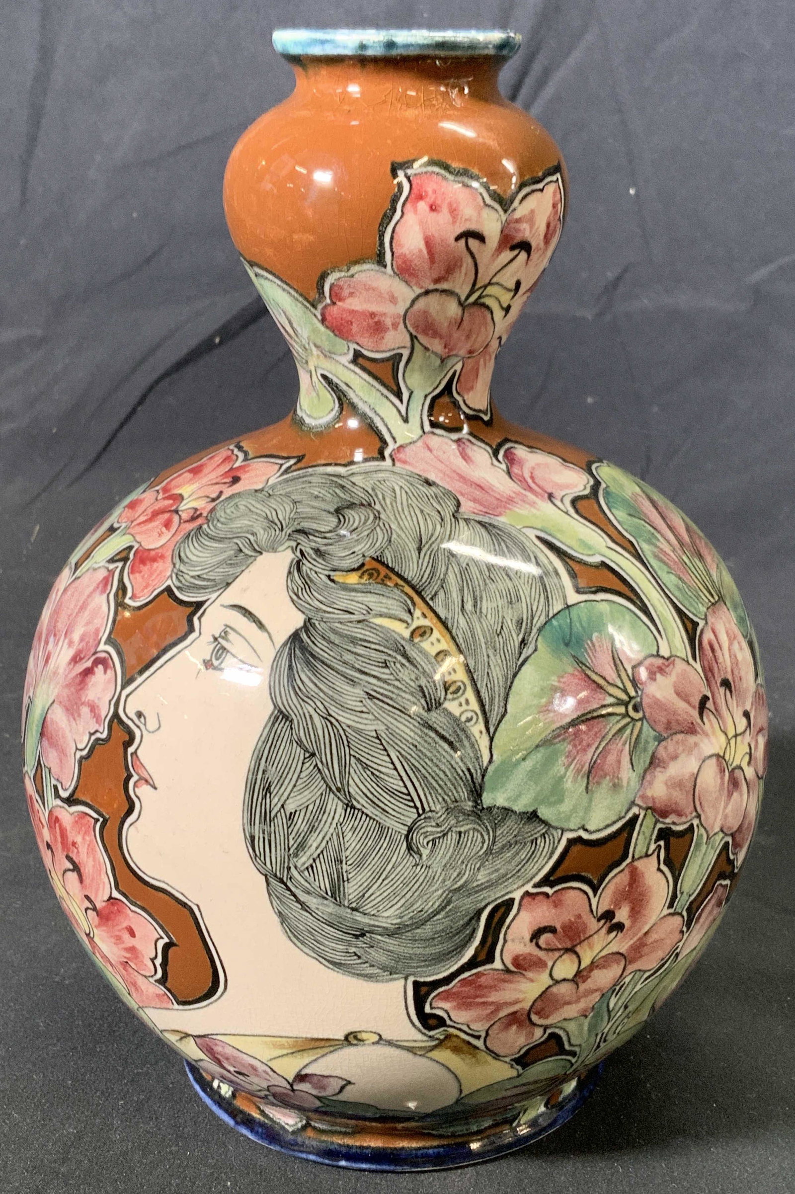 ROYAL BONN Antique Art Nouveau Pottery Vase: ROYAL BONN antique art nouveau pottery vase with figural and floral motifs in hues of brown, pink, and green. Measures approx. 6 inches diameter and 9 inches tall. Wear consistent with age and exposur