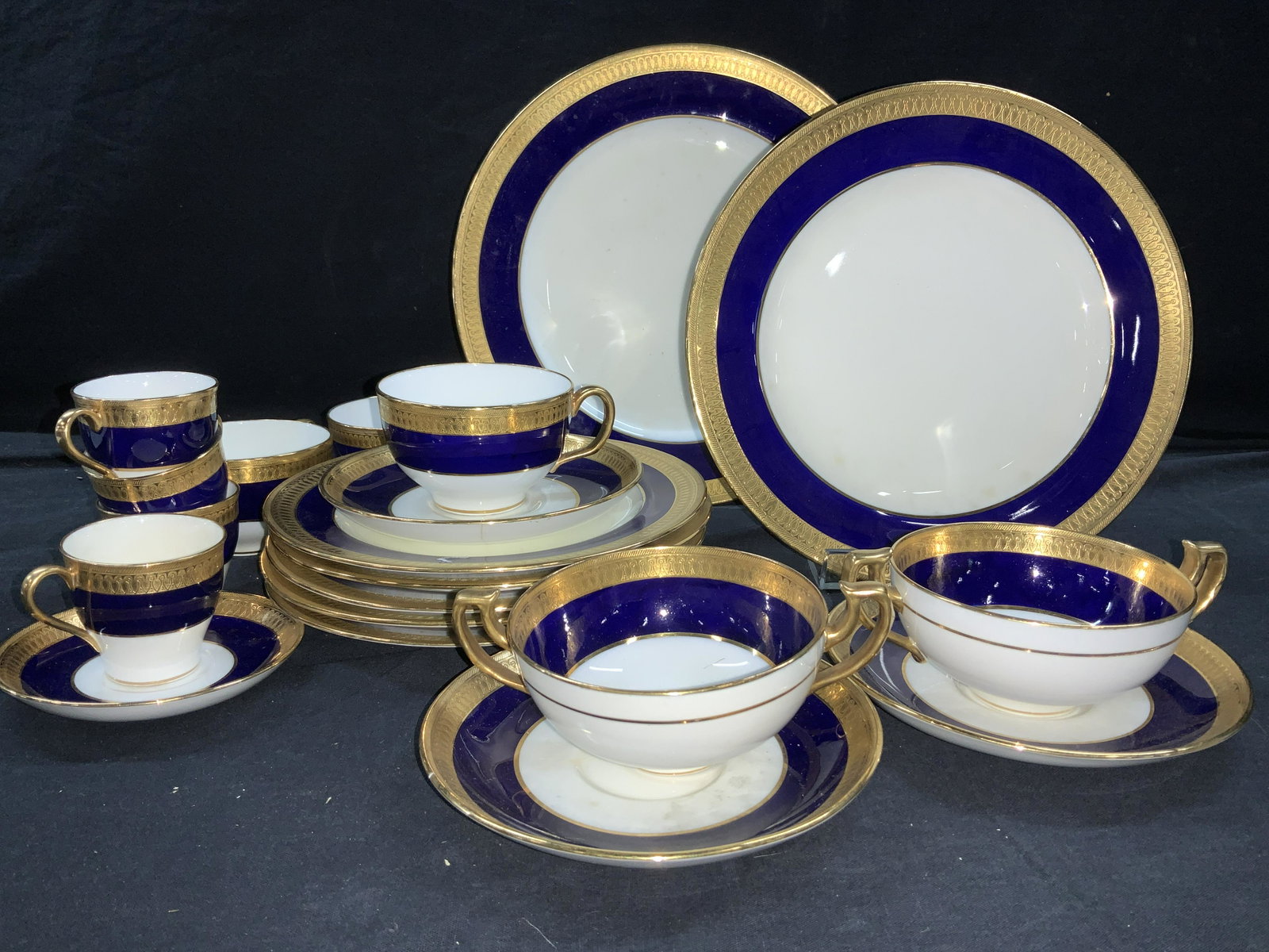 MINTONS 6262 Fine Bone Gilt Chinaware 39: Mintons England Cobalt Blue and Solid Gilt on white porcelain dish set. Gold Encrusted raised crown pattern with Cobalt Blue Band. Pattern: G6262 , hallmarked over glaze. 1 10.25 in. Dinner plate, 3 9