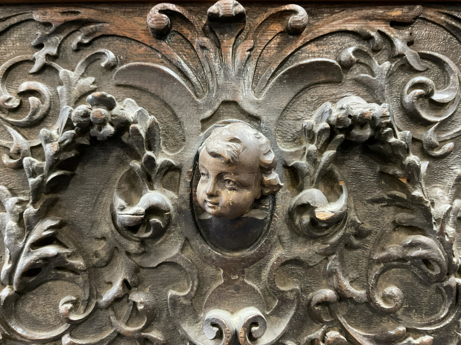 Antique Hand Carved British Relief Sculpture Panel: Antique Hand Carved British Relief Sculpture Panel, circa 18th century, no apparent inscriptions or markings to piece, features Prince of Wales feather design, center contains a carving of a young boy
