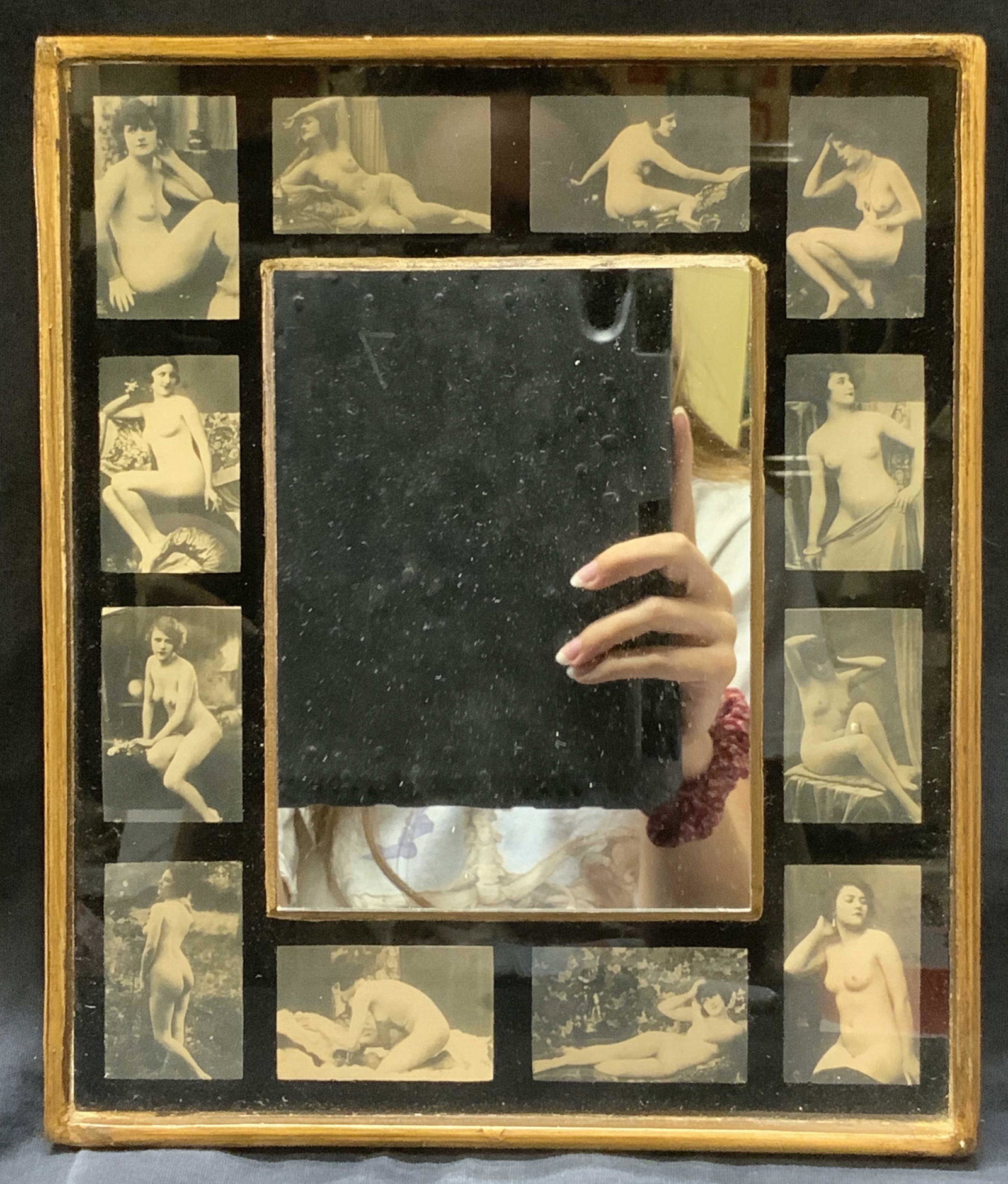 Vintage Women On Film Mirror: Vintage Women On Film Mirror, rectangular mirror with photos of nude flapper women on frame, gilt wood around the edges of the frame, surface wear to frame, professionally framed, not examined out of 