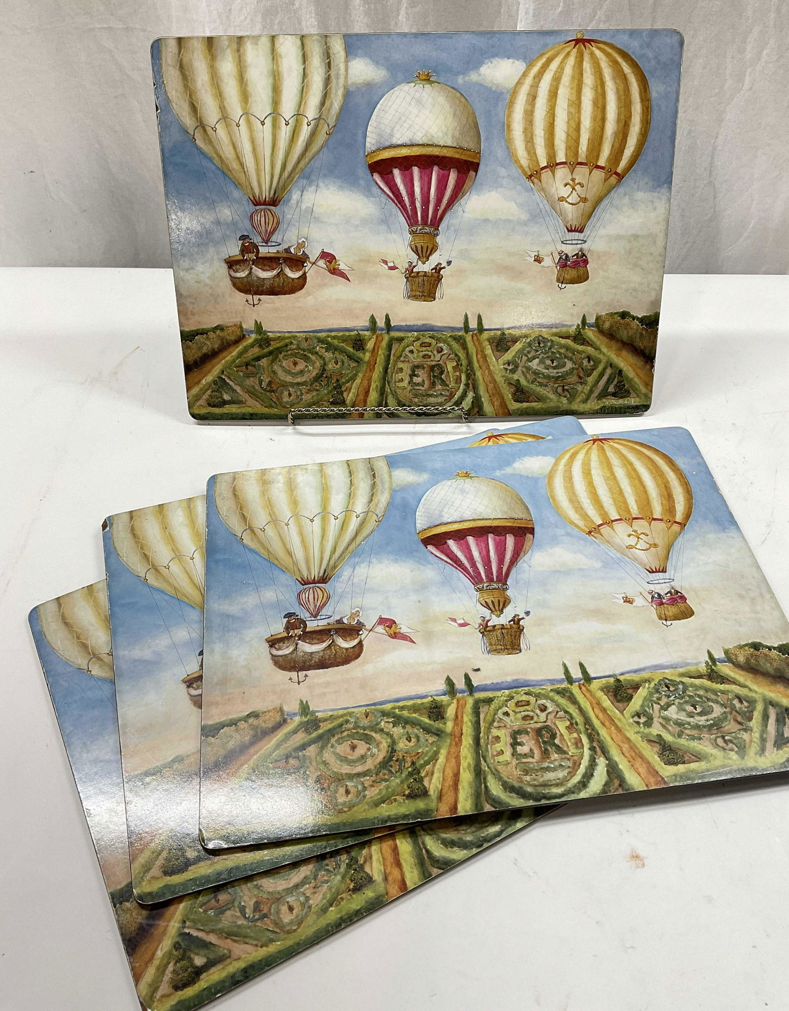 LADY CLARE Tabletop Place Mats, A. Churchill: LADY CLARE Tabletop Place Mats. Felted bottoms, with sticker that reads LADY CLARE. Signed A Churchill. Wear to pieces from use. Some parts to mats are scuffed and worn. Measures approx 15.5 x 11.5 in