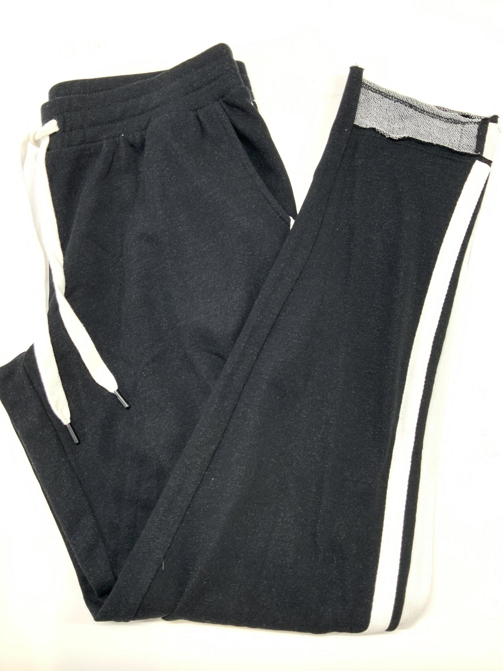 P.J.SALVAGE Size Small Sweat Pants: Pair of black sweat pants with white stripes going up the legs with front waist band tie. Designer tag reads P.J.SALVAGE size Small. 60% cotton, 40% polyester. Inseam is approximately 28 inches. P.J.S