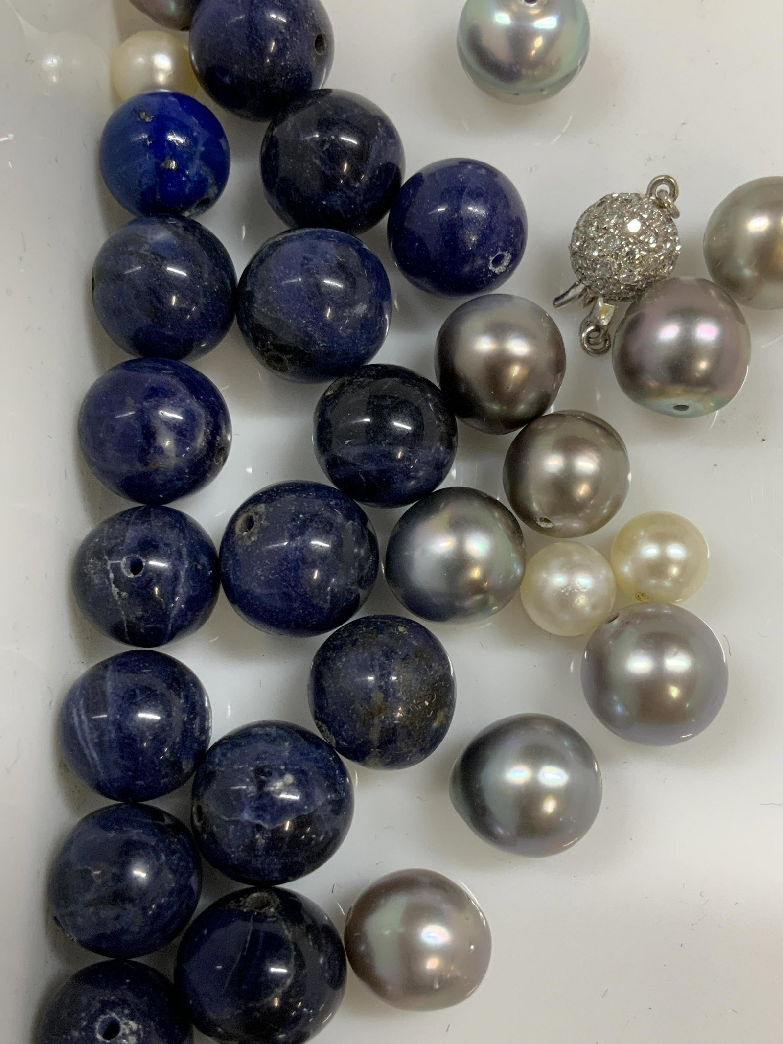 30 Lapis Lazuli and Natural Pearl Beads: 10 mm lapis beads , grey and off white cultured pearls , avg 8-10 mm. Enough to create a bracelet , alternated pearl and lapiz or create earrings. Can combine with other textiles to make a necklace. L