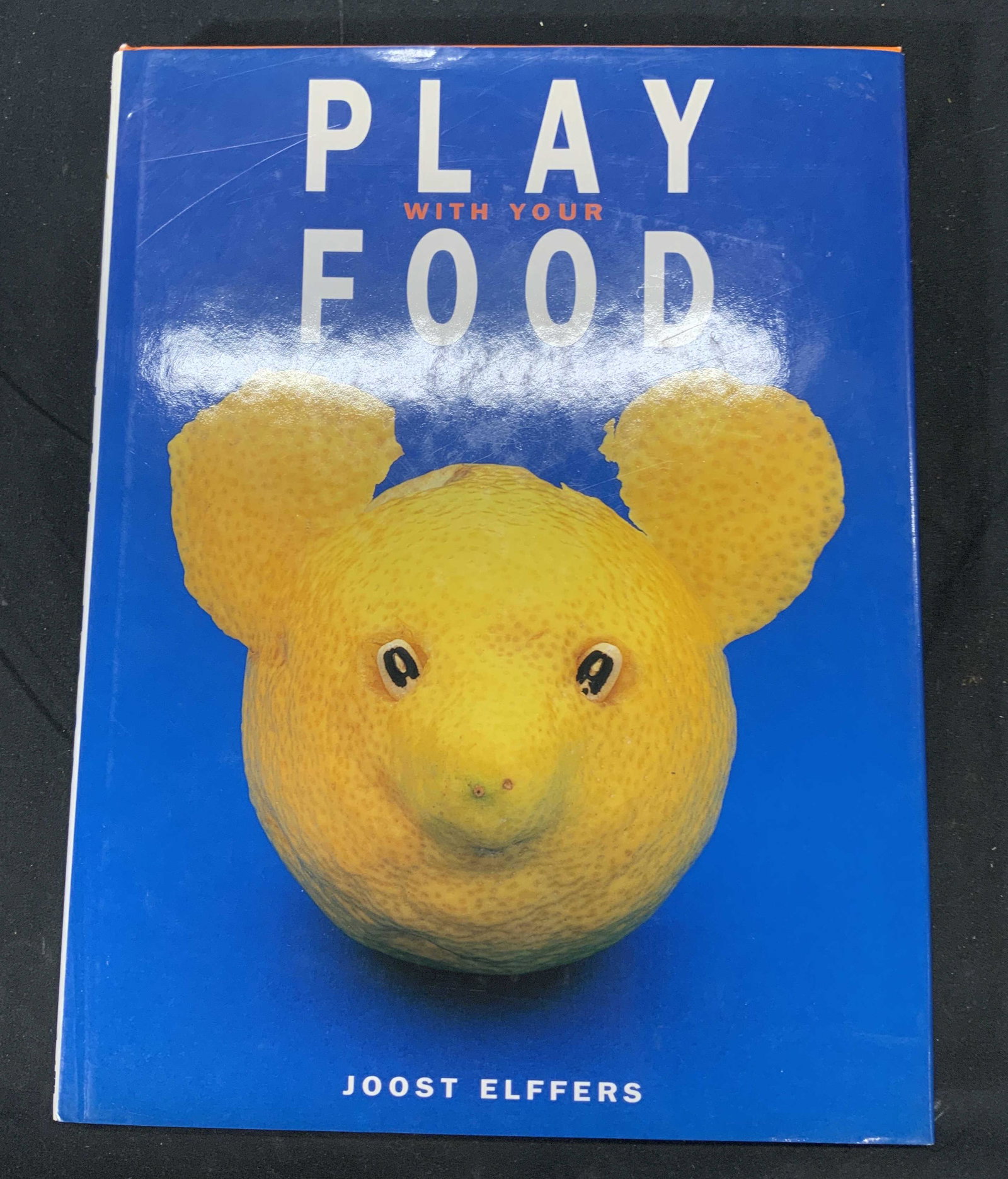 Play With Your Food by Joost Elffers: Hardcover copy of Play With Your Food by Joost Elffers. Published by Stewart, Tabori and Chang, 1997. Some wear to book jacket consistent with exposure. Measures approx 8 1/2 in by 11 in. Play with yo