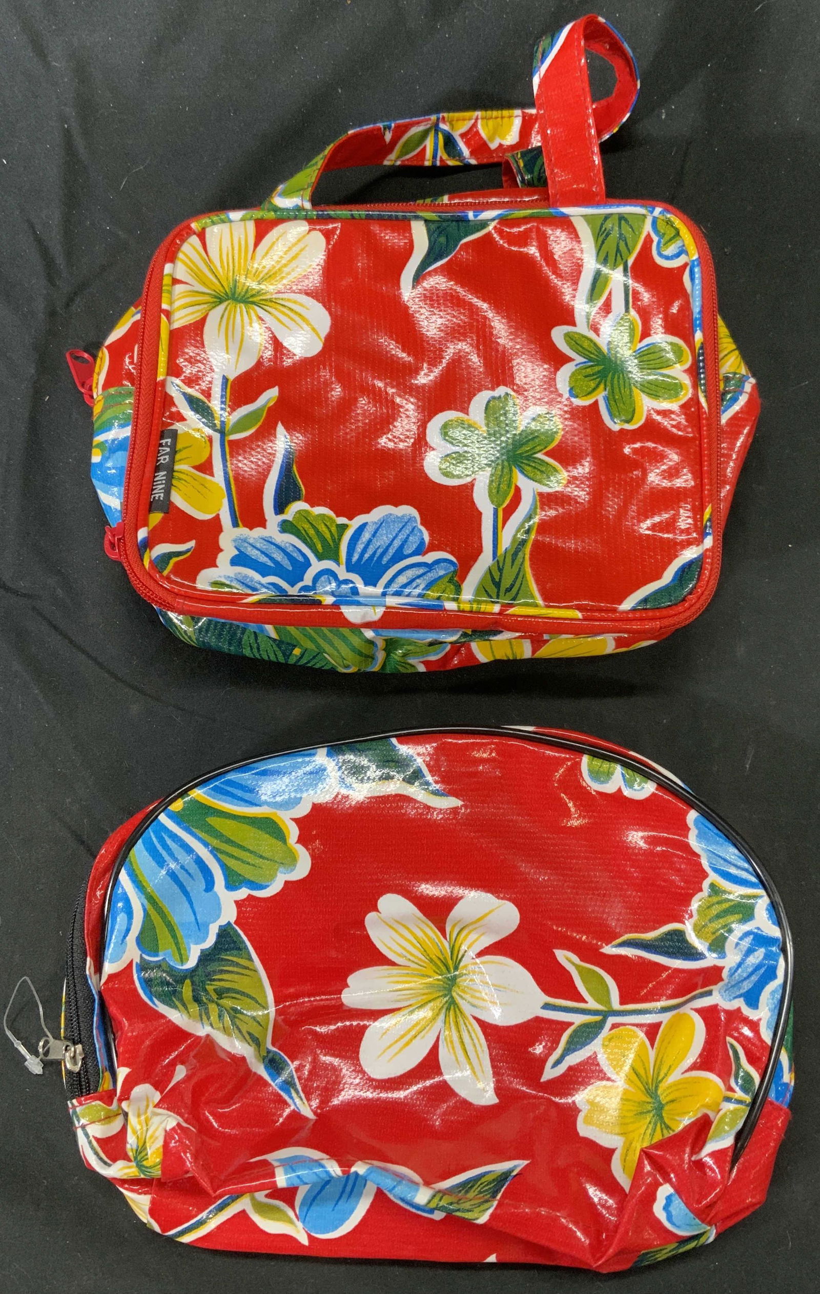 Set 2 FAR NINE Floral Cosmetic Bags: Set of 2 Far Nine cosmetic bags with floral motif in hues of red, blue, green, and yellow. Dimensions vary, approx. 8 x 2.5 x 6 inches. New without tags. Far nine, far nine cosmetic bag, far nine acce