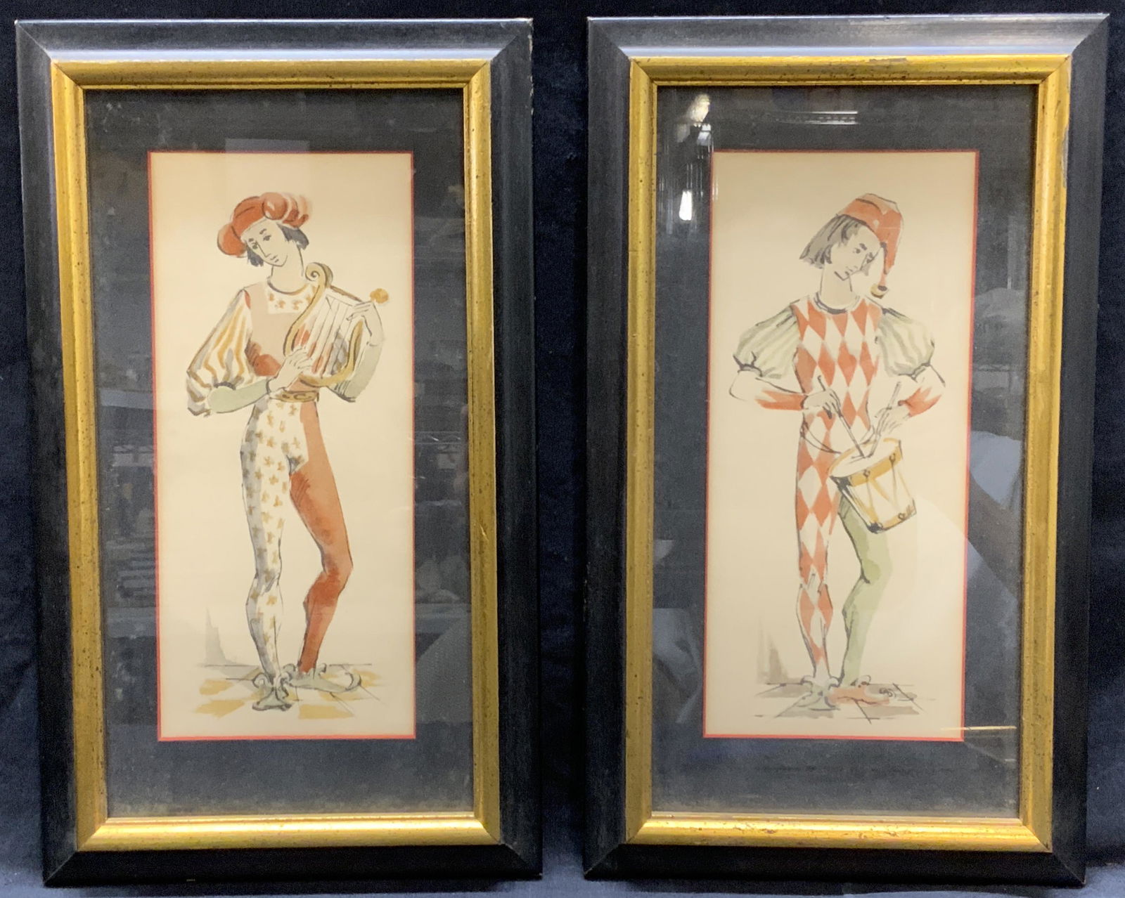 Pair Musician Court Jesters Watercolor Lithographs: Pair Instrumental Court Jesters Watercolor Lithographs, no apparent inscriptions, 1/2 shows jester holding a harp, 2/2 shows jester playing a drum, in frames each measure approx 12 3/4 x 7 1/2 in., bl