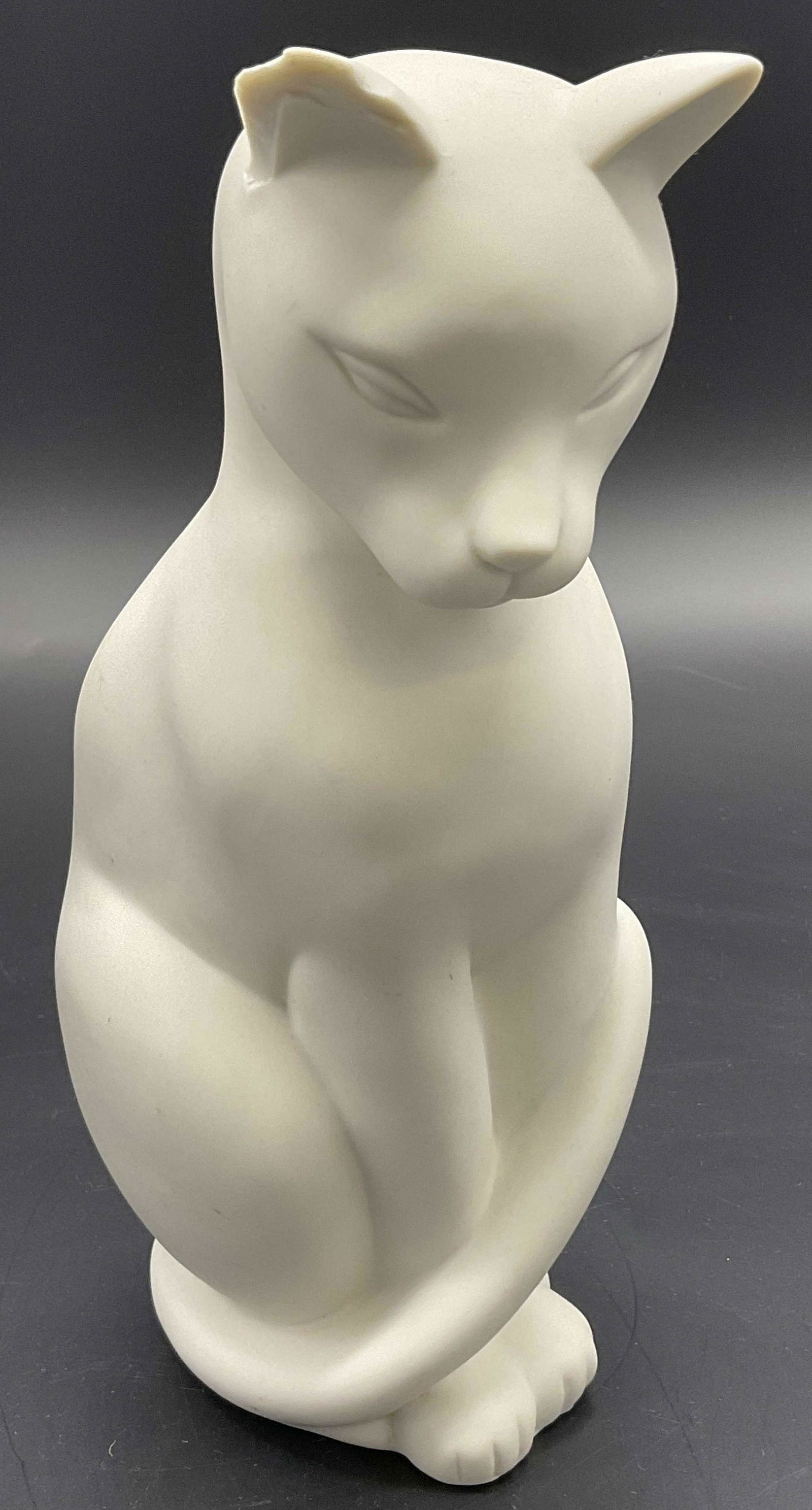 Bisque Porcelain Cat Sculpture, Crowning Touch: Bisque White Porcelain Cat Sculpture. Crowning Touch Label at bottom of piece. Measures approx 8.75H x 5W inches, chip to cats right ear. Bisque porcelain, cat sculpture, porcelain cat, bisque porcela
