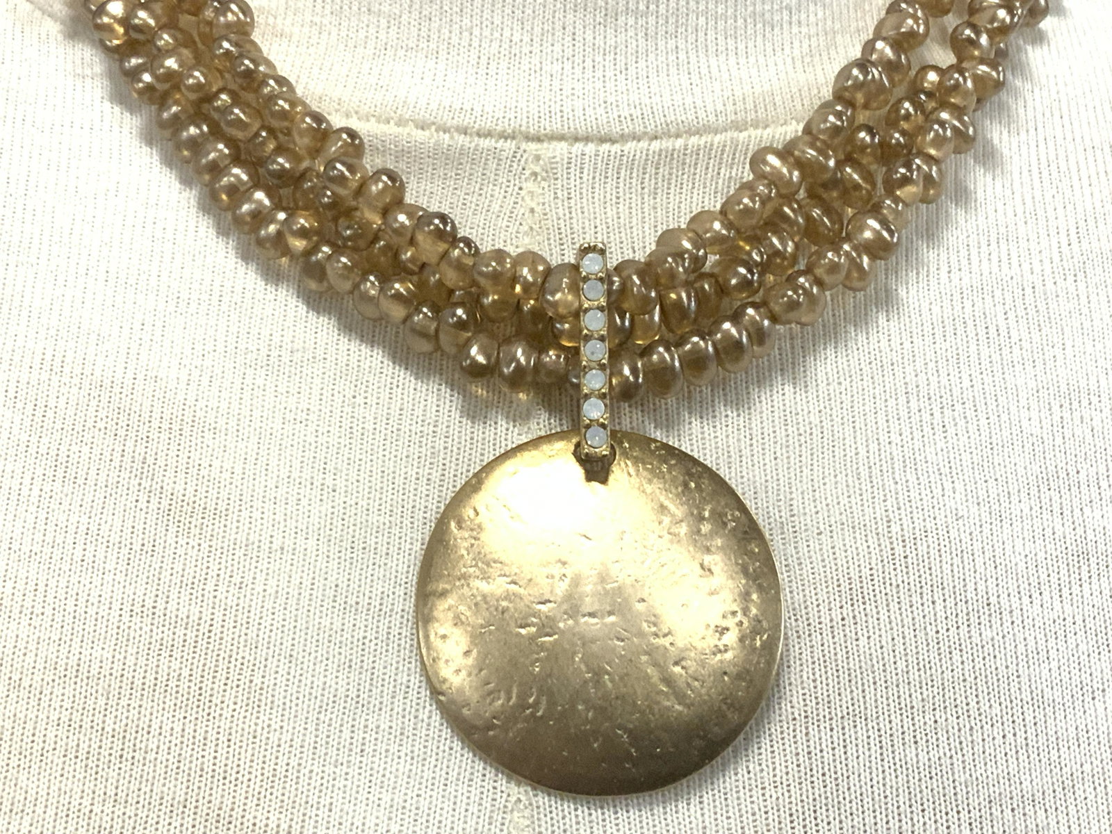 CHICOS Pearlescent Pendant Necklace: CHICOS Pearlescent Pendant Necklace, multiple strands amber toned pearlescent beads, lobster claw clasp, measures approx 16 - 19 in., length adjustable. CHICOS pearlescent pendant necklace, costume Pe