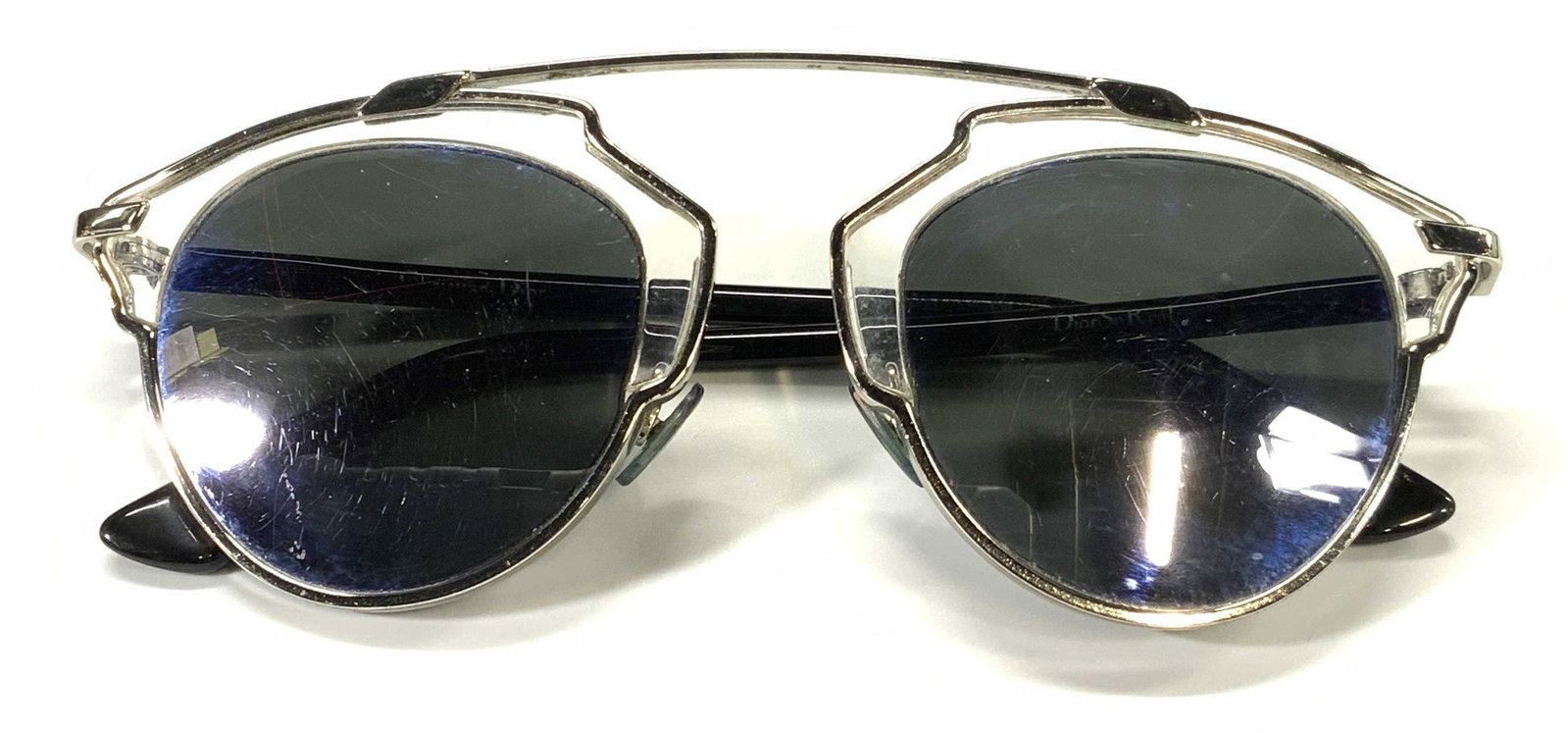 CHRISTIAN DIOR So Real Luxury Sunglasses: Christian Dior So Real sunglasses with transparent acetate silver tone metal frames. Designer trademark to interior arm. Style number RM202AYWEP. Wear consistent with use and exposure. Christian Dior,