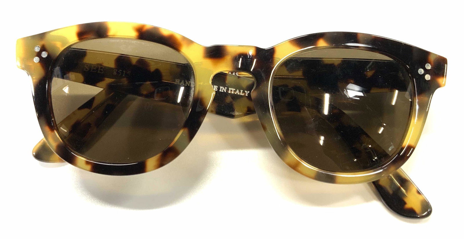 SEE EYEWEAR Ladies Tortoise Sunglasses: See Eyewear designer sunglasses in multi tone tortoise pattern. Acetate frames. Designer trademark to interior arm. Style number 8515. Wear consistent with use and exposure. See eyewear, designer sung