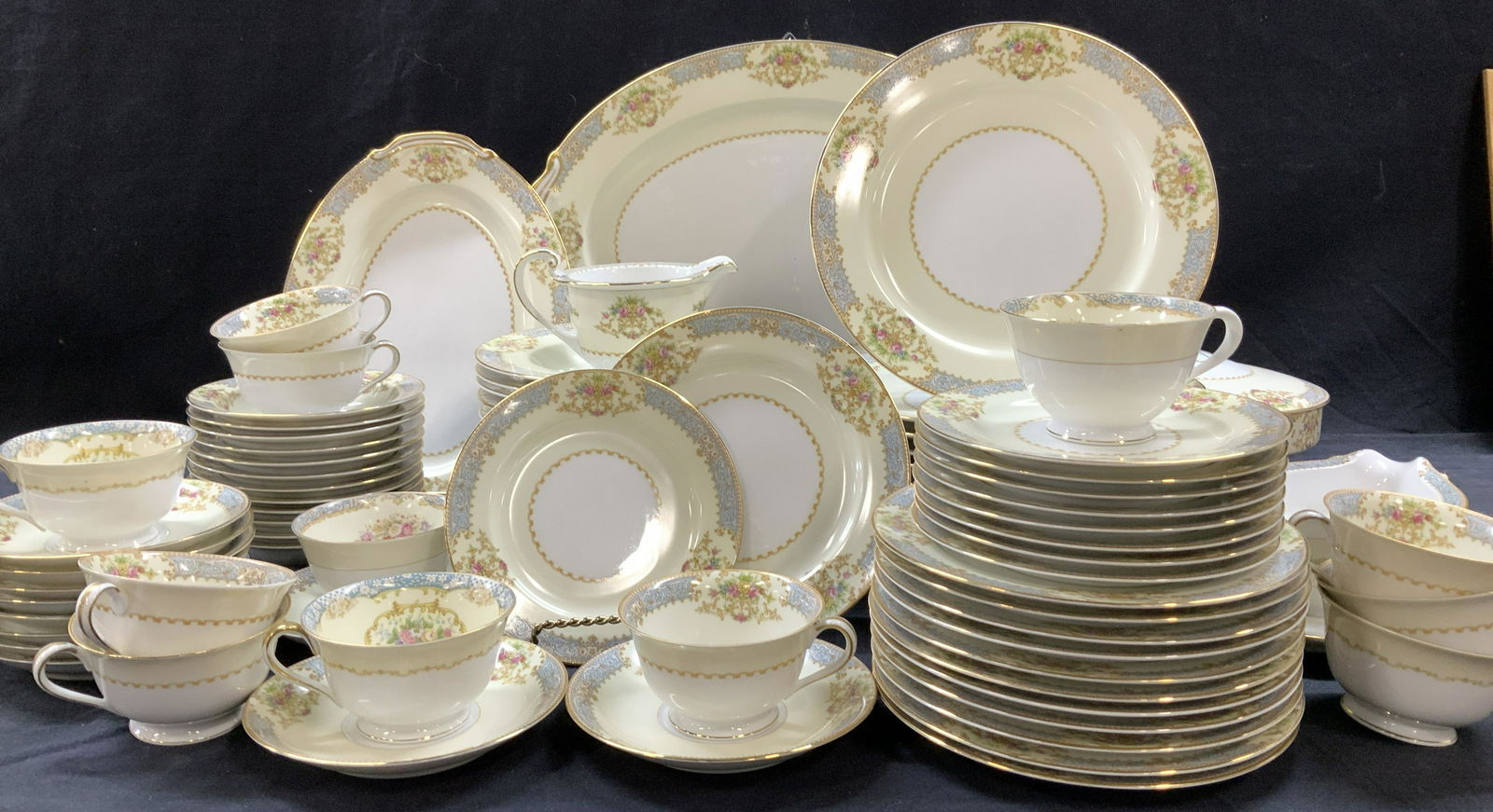 Set 85 NORITAKE Gilt & Floral Chinaware, Japan: White and cream toned Noritake chinaware set, no issues. A beautiful set with dainty florals with a powder blue border and white daisies, yellow cartouche and colorful flowers. Set includes: 2 platter