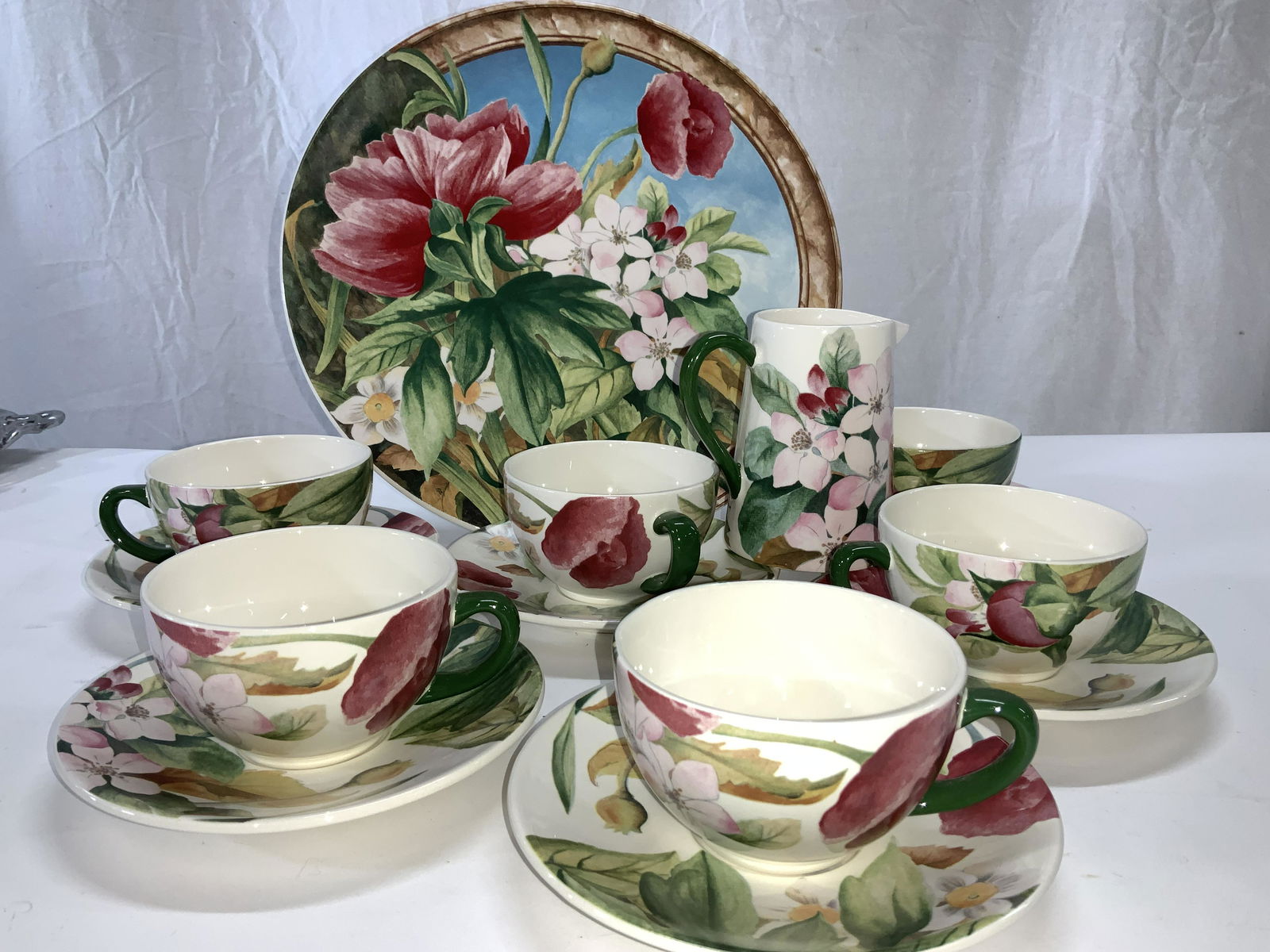 Set 14 Gien France Volupte Cups & Saucers, more: Set of Gien France Luxury Hand Painted porcelain Tea cups and saucers , 6 of each. Additional creamer 4.5 in ht. , serving plate 12 in. that is signed lower corner D. LALANDE. Signed D. Lalande for Gi