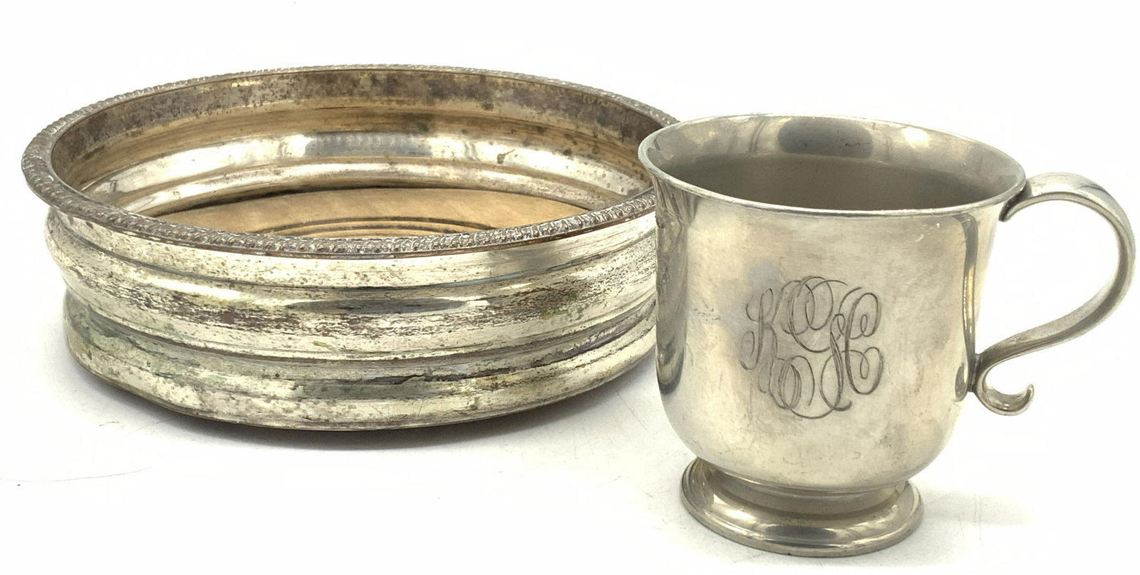 Vintage White Metal Wine Coaster Lenox Pewter Cup: Group lot of 2 metal accessories, 1 white metal vessel with wooden base, approximately 5.25 inch diameter. 1 pewter cup, monogrammed on side. Marked Williamsburg Lenox, Kirk Stieff, Pewter, approximat