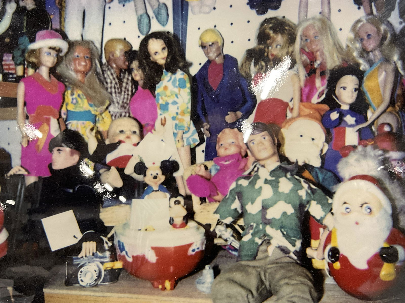 Photograph of Vintage Toys, Art Oddity: Photograph of Vintage Toys, no apparent inscriptions or signatures to piece, not examined out of frame, subject a photograph of dolls, action figures, and Christmas toys in a store, measures 14 1/2 x