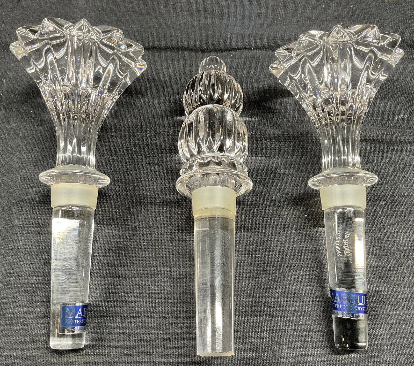 Lot 3 Pair WATERFORD Crystal Wine Stoppers, More: Pair WATERFORD Crystal Wine Stoppers/Glass Stopper, comes in original box, inscriptions and labels readMarquis Waterford Crystal, Brookside Wine Stopper One Pair, no apparent inscriptions to other sto