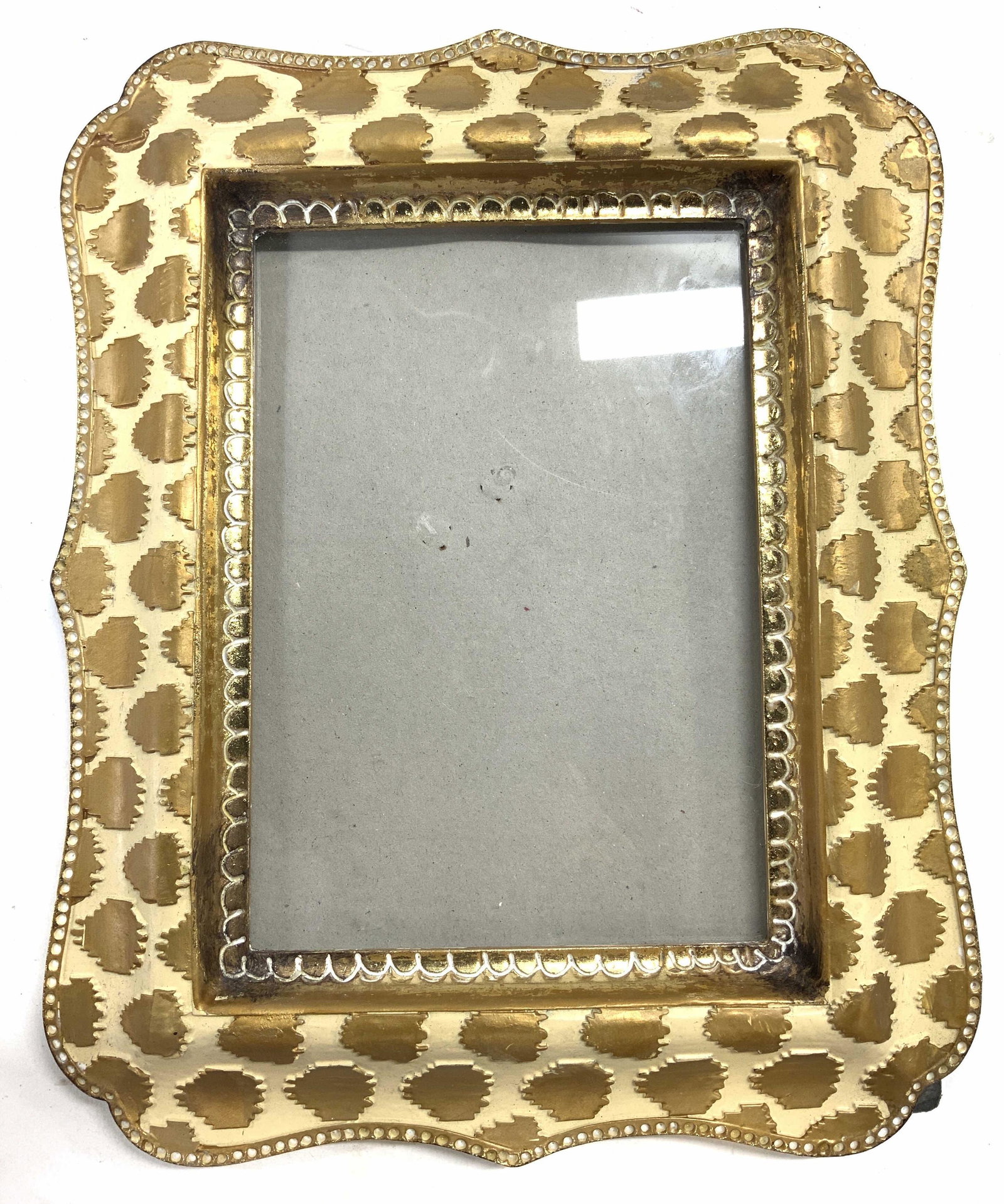 SICURA Picture Frame In Cream & Gold: Backside of frame reads SICURA. Frame is cream and gold toned. Frame measures approx 10 inches tall 8 inches wide. SICURA picture frame, SICURA frame, photo frame, homewares, home decor. Stand needs r