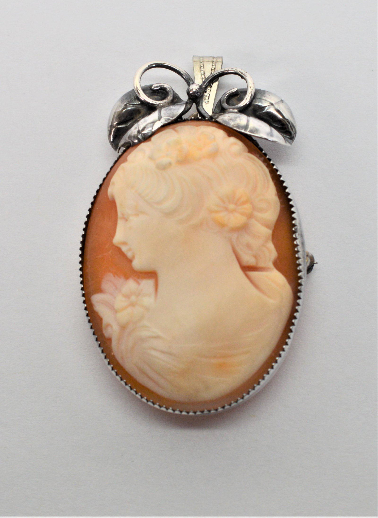 Antique Cameo W Handcrafted Sterling Silver Frame: This a beautiful, antique handcrafted cameo that can be worn as a pin or pendant. It measures 2" x 1.25". -NB