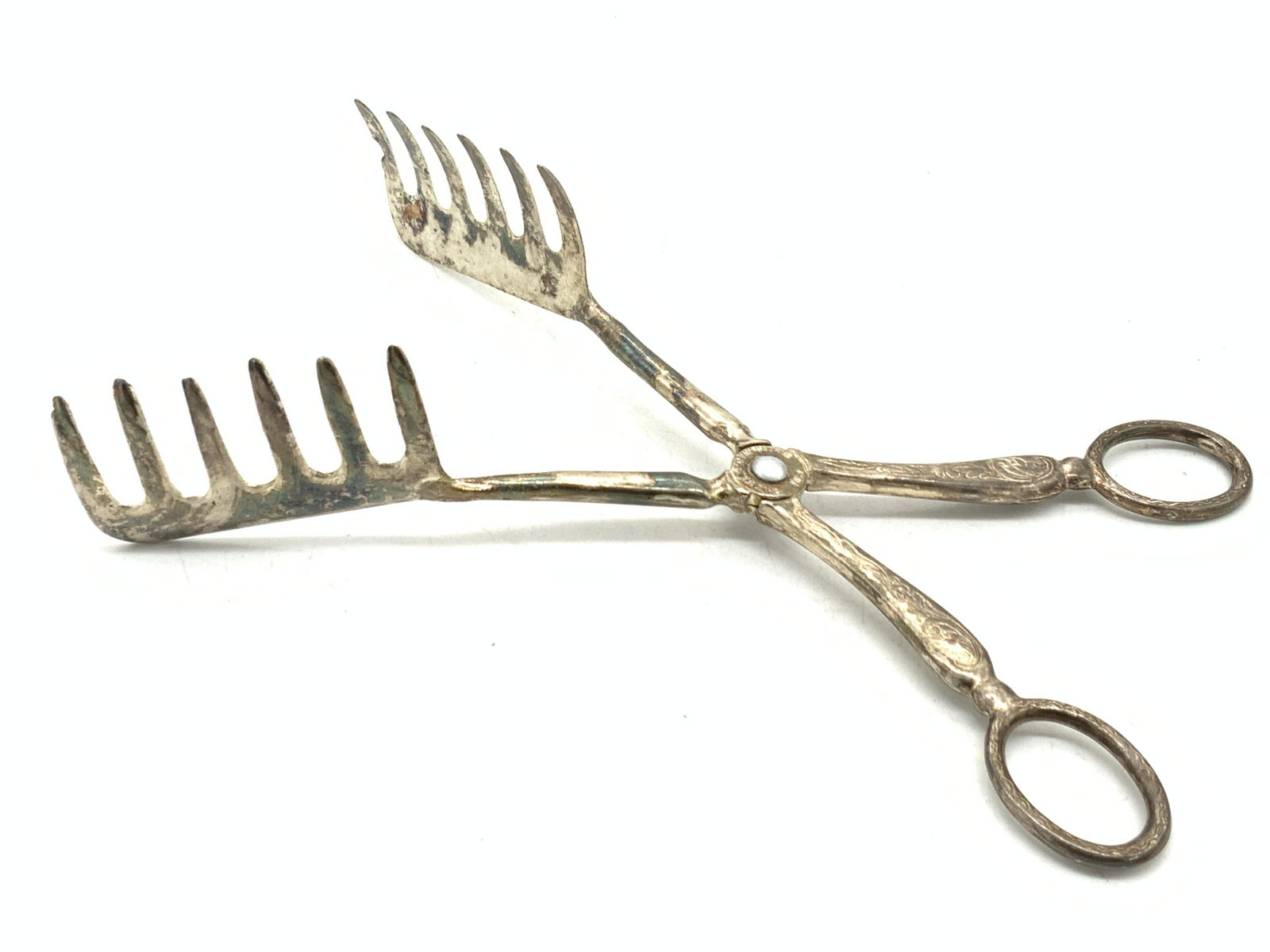 E.P.ZING Vintage Silver Plate Forked Tongs, Italy: Pair of forked tongs with comb style ends. Handles are etched with scroll designs and center is marked E.P.Zing, Silverplate, Italy. Approximately 8.75 inches long. Condition is consistent with vintag
