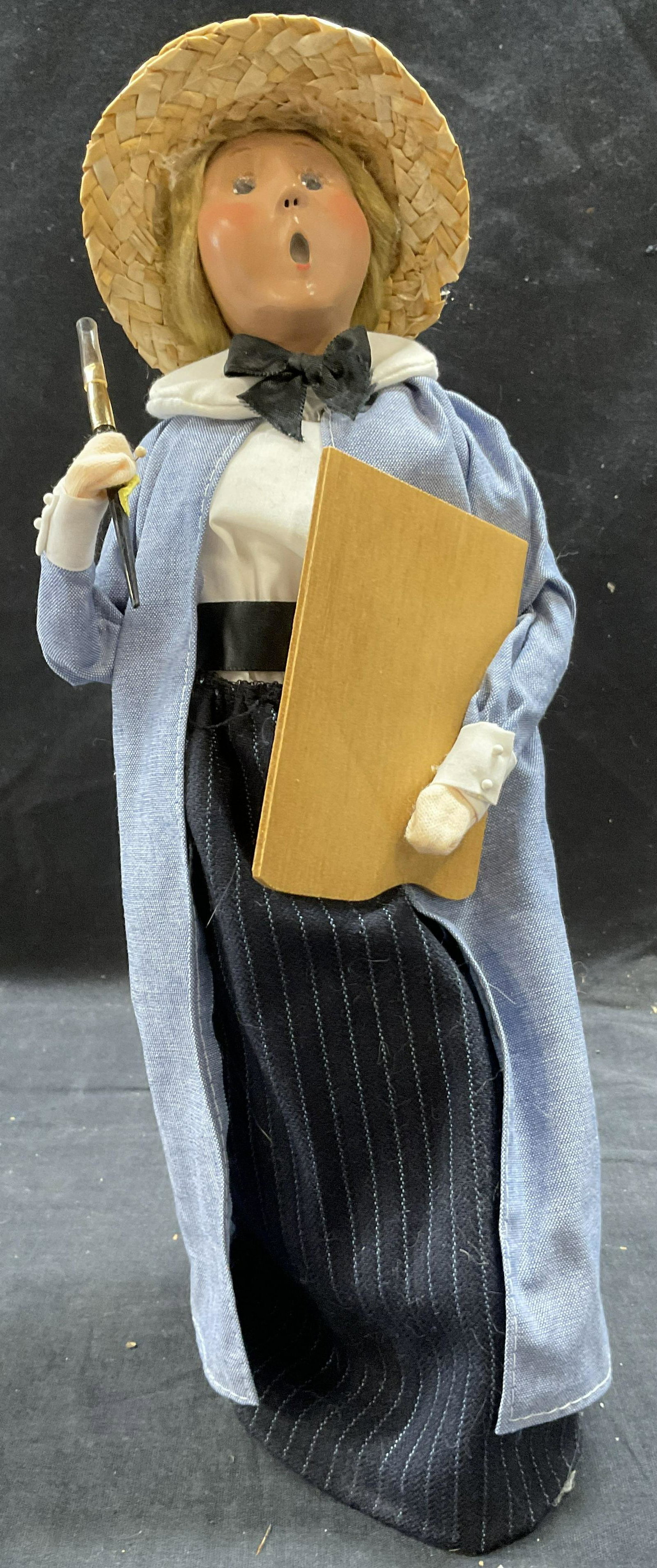 BYER CHOICE Mary Cassatt Doll: BYER CHOICE Mary Cassatt Painter Doll, inscriptions read Byers Choice, Fig Cassatt, a doll holding a paintbrush and easel, measures 12 3/4 inches tall x 5 1/4 inches wide, surface wear to piece, BYER 