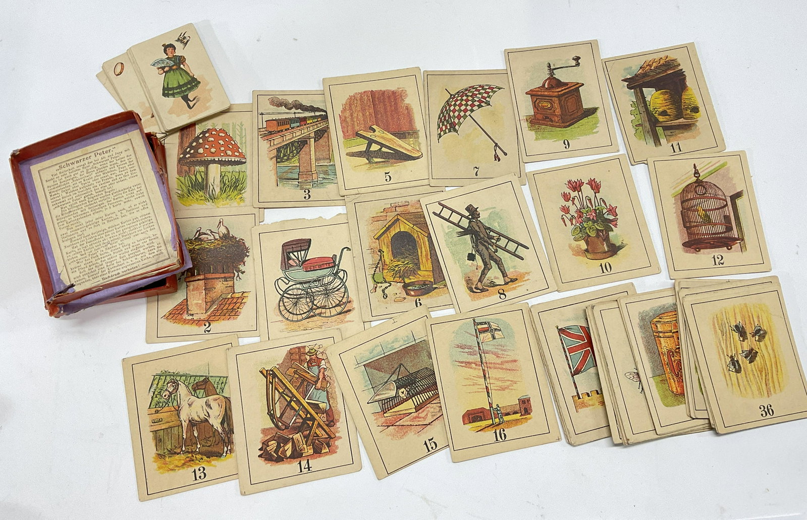 Schwarzer Peter Playing Cards W Images: Schwarzer Peter Playing Cards w cards. Directions written in German. Possibly has missing cards. Illustrated colored images. German game, card game, German card game, illustrated card game, schwarzer 