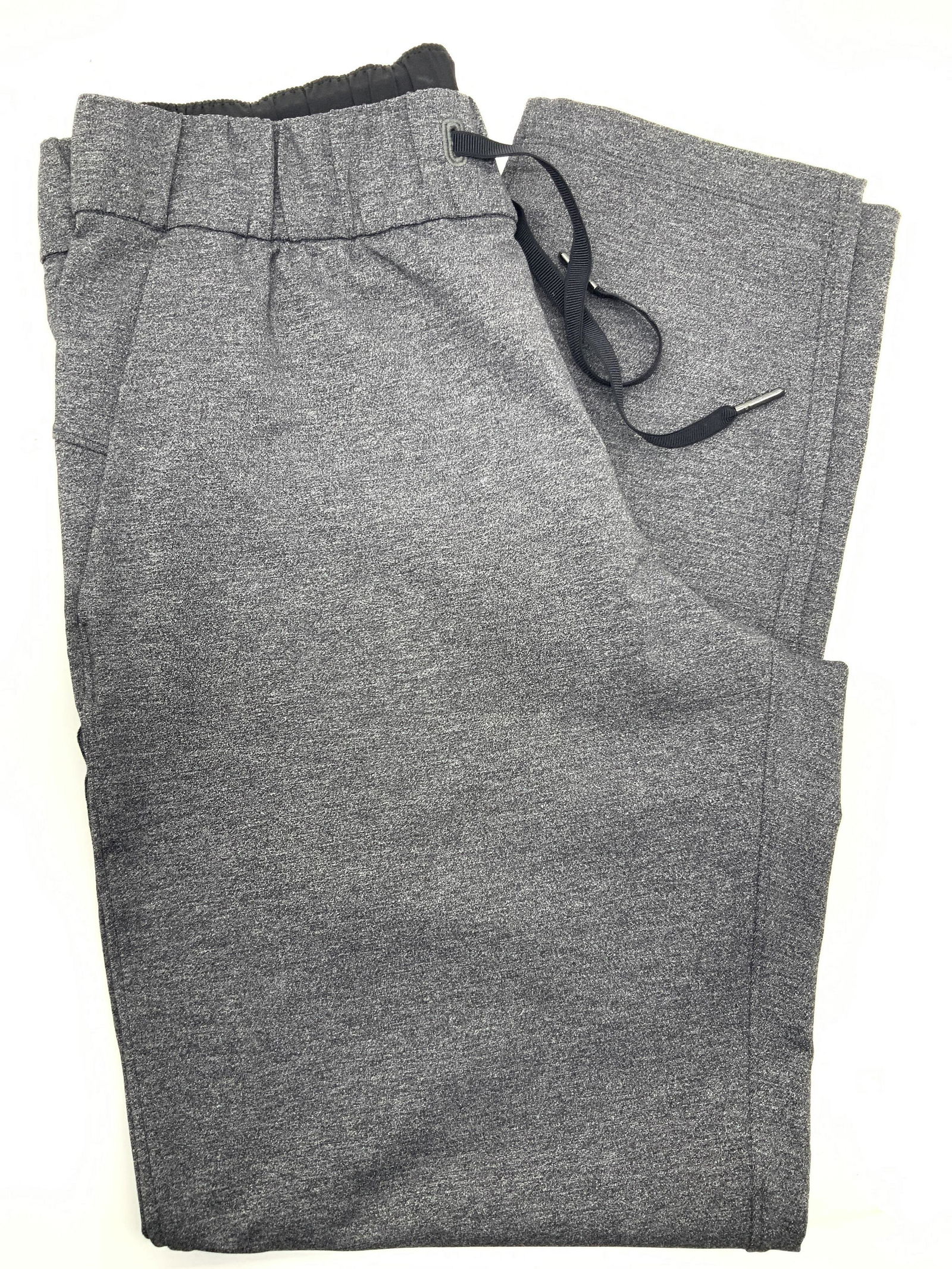 Gray Toned Joggers: Pair of gray toned elastic waist band joggers with tie waist. No material tag or Designer tag. Waist measures 28 inches around, inseam is approximately 26 inches long. Joggers, athletic joggers, runni
