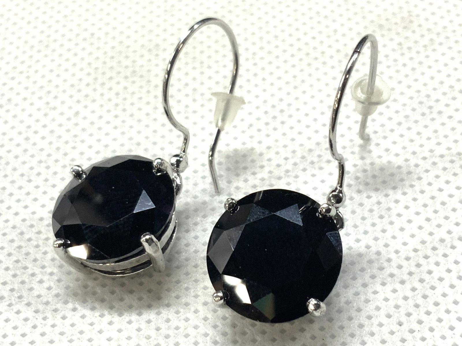 LORD & TAYLOR Sterling & Cubic Zirconium Earrings: Dangling earrings with sterling posts and black faceted cubic zirconium. Comes with card marked Lord & Taylor, sterling silver, and Cubic Zirconium. Approximately 1.75 inches long. Total weight 0.32 o