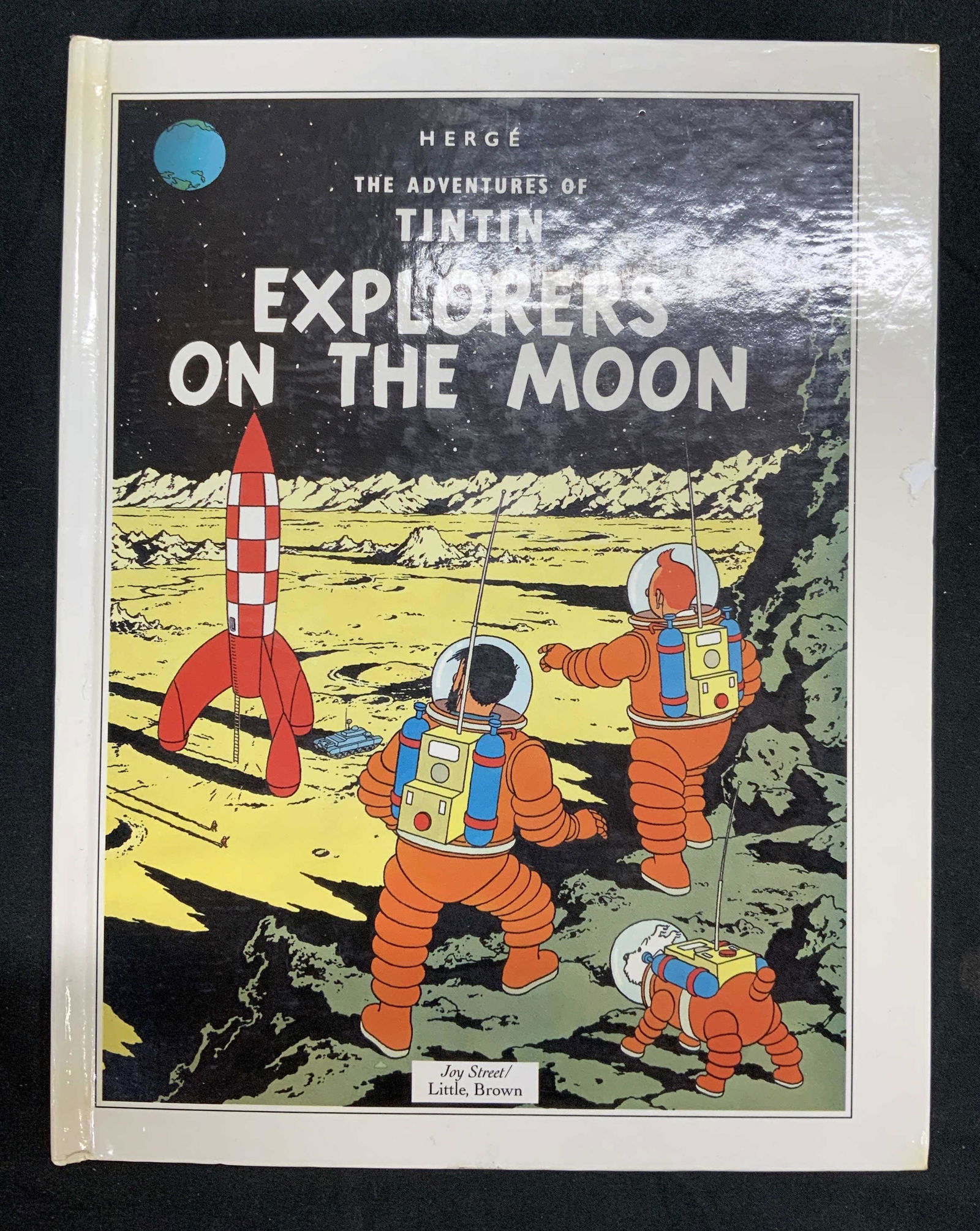 TINTIN Explorers On The Moon Popup Book: Hardcover copy of The Adventure of TINTIN: Explorers On The Moon by Herge. Published by Little, Bronw, 1992. Popup book. In good condition, some wear consistent with exposure. The adventures of TINTIN
