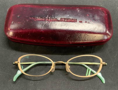 MARTINE SITBON Designer Eyeglasses & Case: MARTINE SITBON designer eyeglasses and case. Metal frames with teal arms. Designer label to interior arm. Wear to case consistent with exposure. MARTINE SITBON, MARTINE SITBON glasses, ladies glasses,