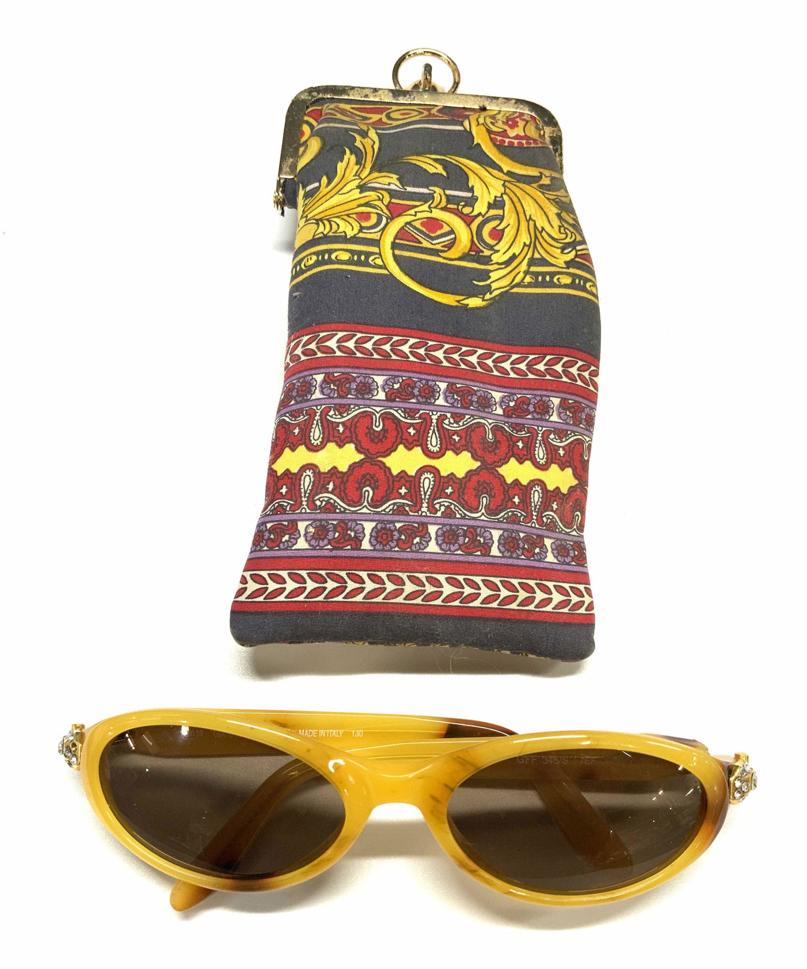 GIANFRANCO FERRE Yellow Cat Eye Sunglasses: Vintage GIANFRANCO FERRE yellow cat eye sunglasses with crystal decoration. Includes pouch with kiss clasp. Some surface wear to pieces consistent with age and exposure. GIANFRANCO FERRE, GIANFRANCO F