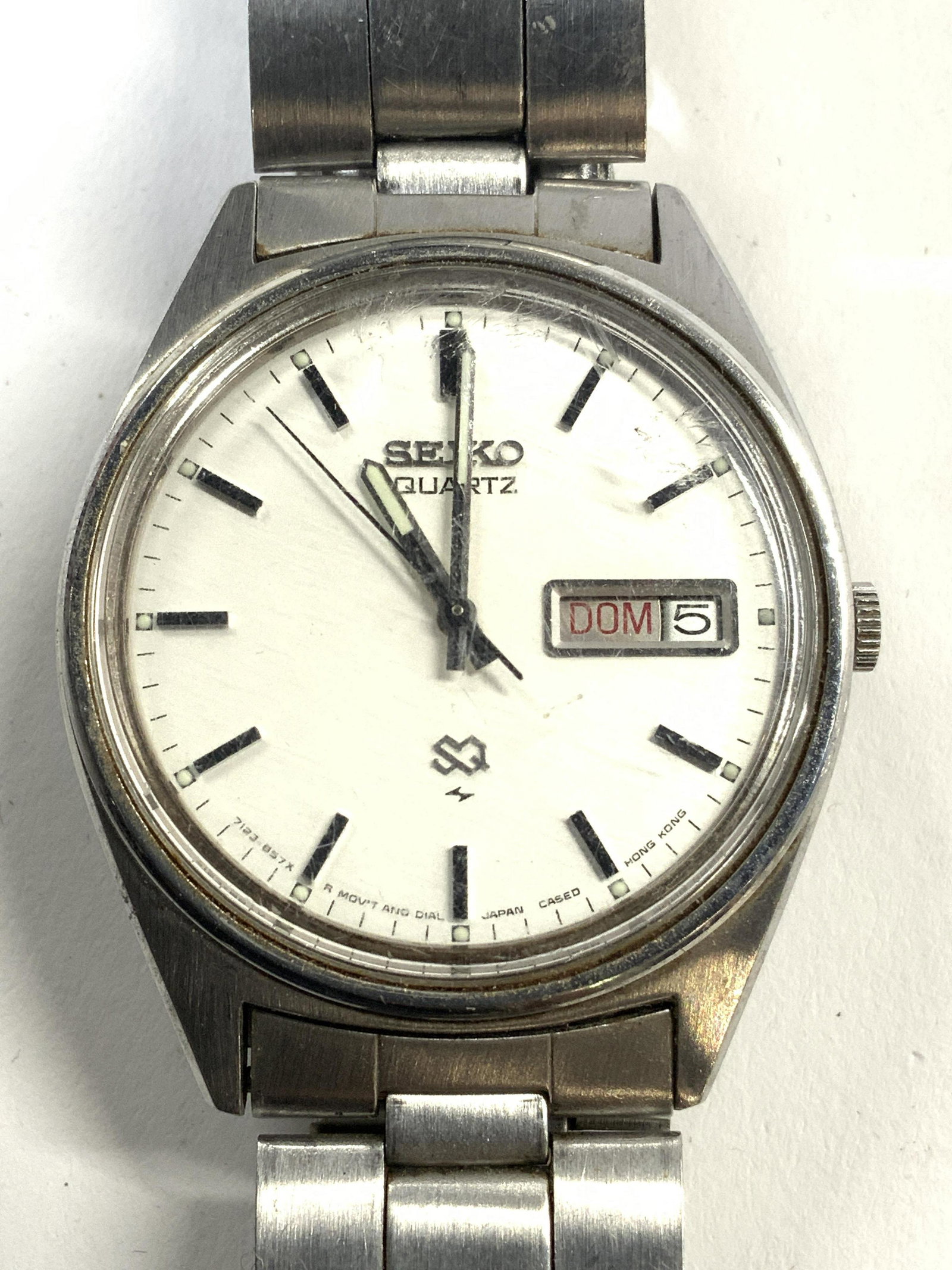 SEIKO Wristwatch W Stainless Wristband: Clock face reads SEIKO QUARTZ. Piece is silver toned and stainless. 3.75 inches doubled, clock face measures approx 1.75 inches wide. Watch, stainless watch, metal watch, SEIKO watch, wristwatch, meta