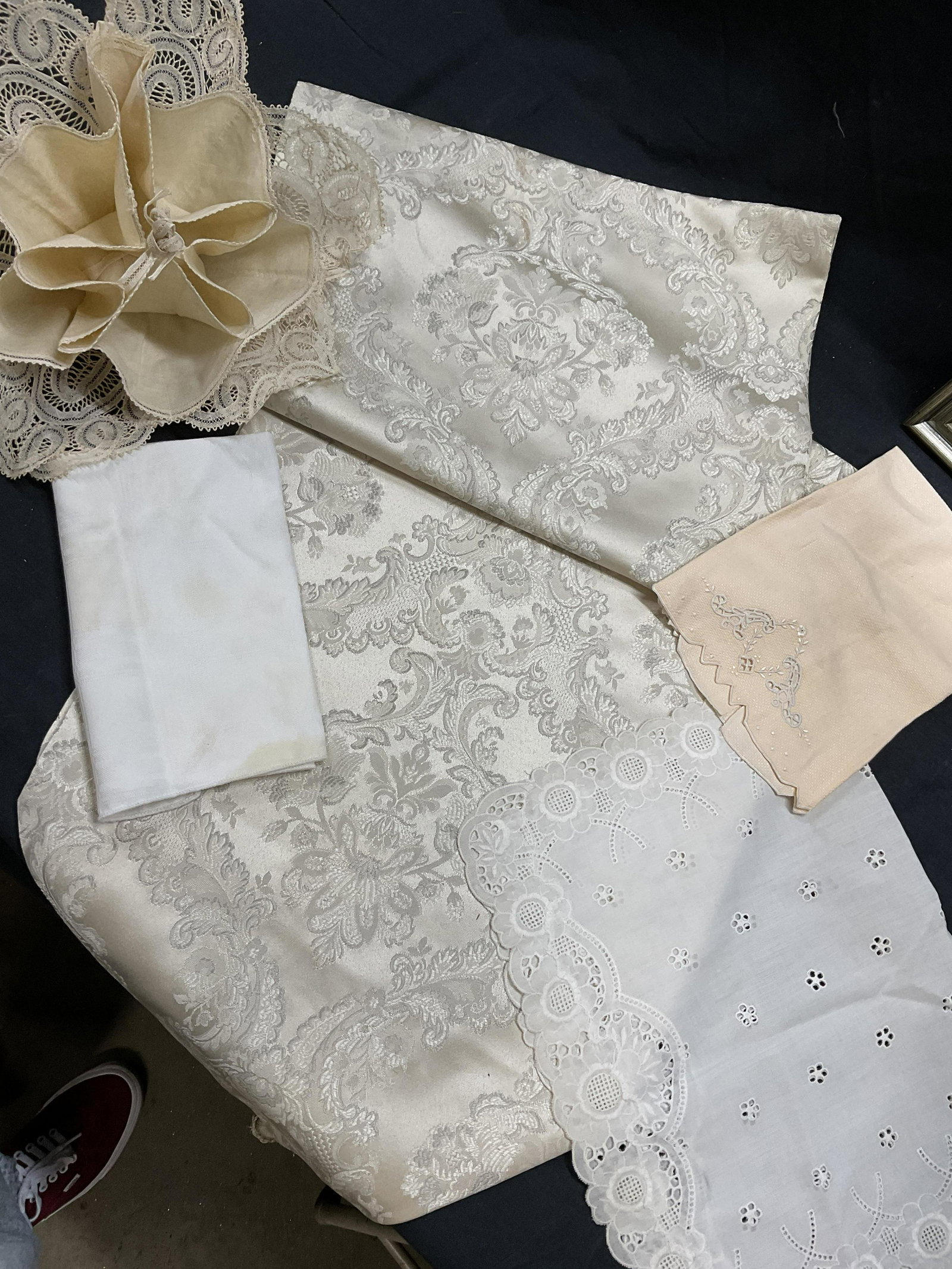 Lot Lace & Damask Tabletop Linens: Lot Lace & Damask Tabletop Linens. Damask tabletop runner measures approx 88 inches in length. Small tabletop linens have embroidered or lace details. Pieces all have minor stains present. Tabletop li