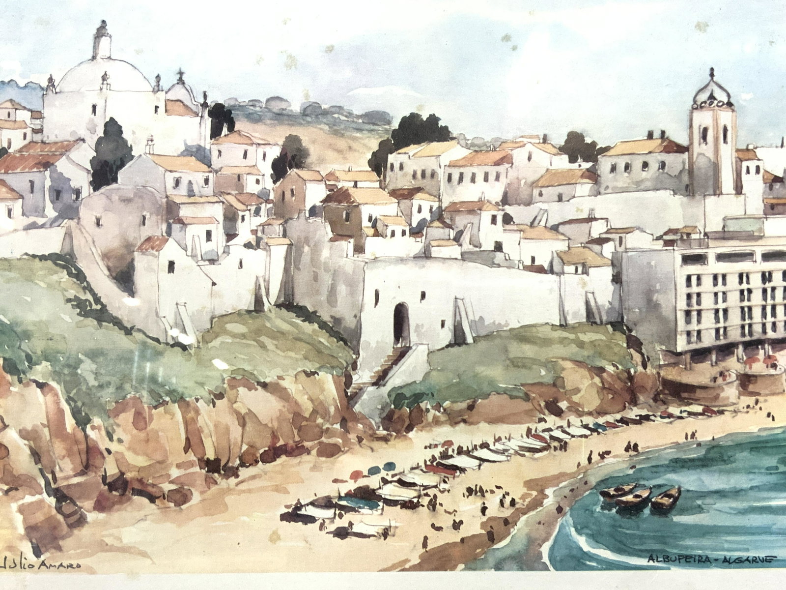 JULIO AMARO Albufeira-Algarve Shoreline Lithograph: JULIO AMARO Albufeira-Algarve Shoreline Lithograph, lower right inscribed Albufeira- Algarve, lower left signed Julio Amaro, subject shows a beach with white washed city, in frame measures approx 16 3