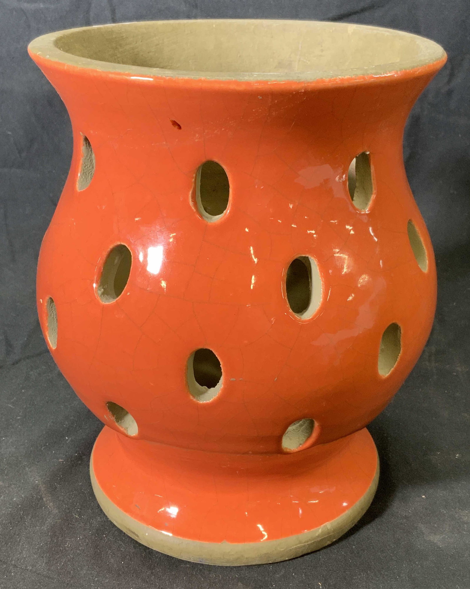CRATE & BARREL Orange Pottery Vessel: Crate & Barrel orange pottery vessel with perforated decoration. Measures approx. 7 inches diameter and 7.75 inches tall. Surface wear consistent with exposure, crazing present. Trademarked to undersi