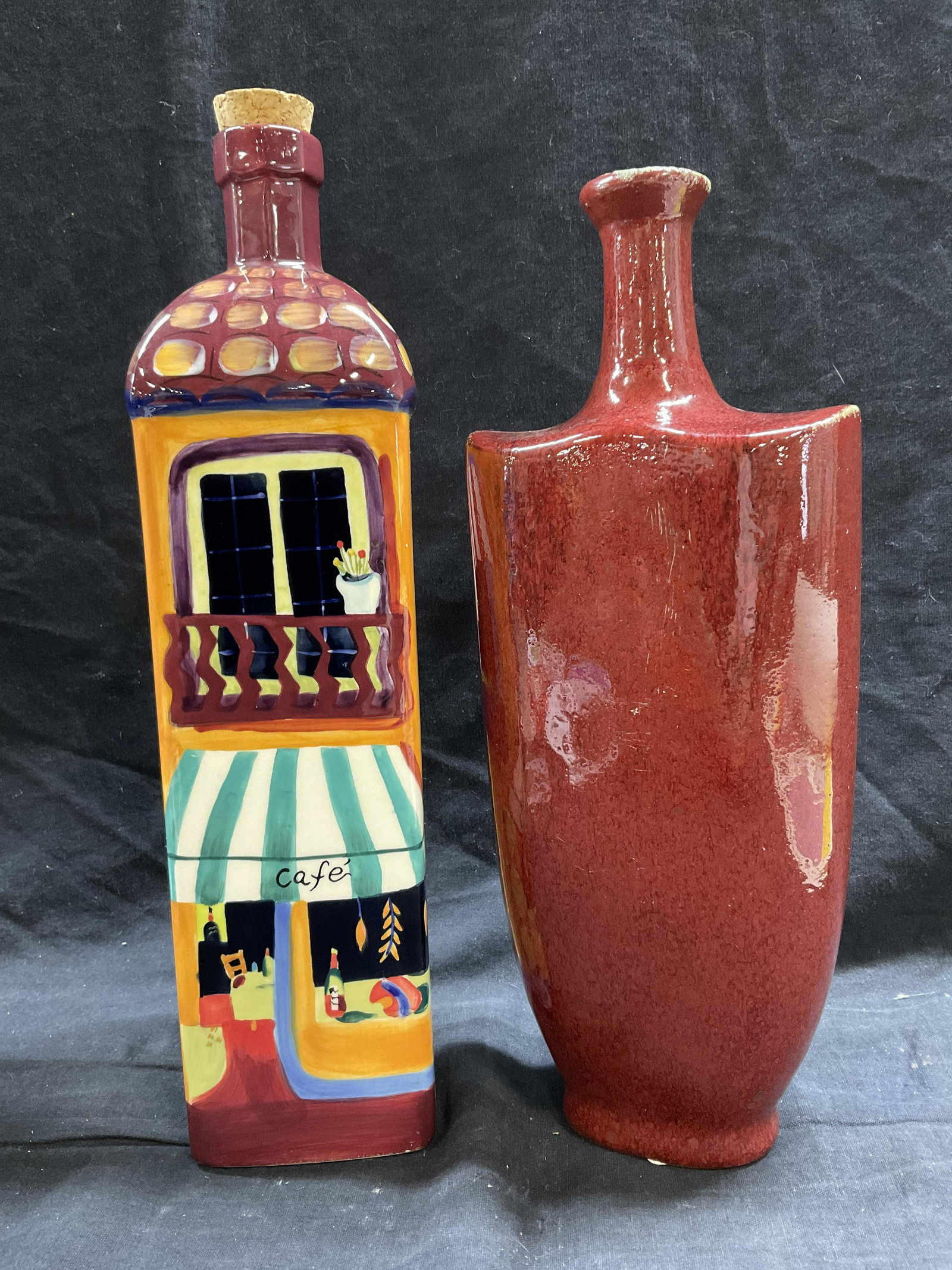 Lot 2 Ceramic Decorative Bottle Decor: Lot 2 ceramic Decorative Bottle Decor. Measures approx 13 x 5.5 inches. Cork to top of one. General wear due to age and use. Ceramic vessels, ceramic decor, restaurant decor, restaurant ceramic ware, 