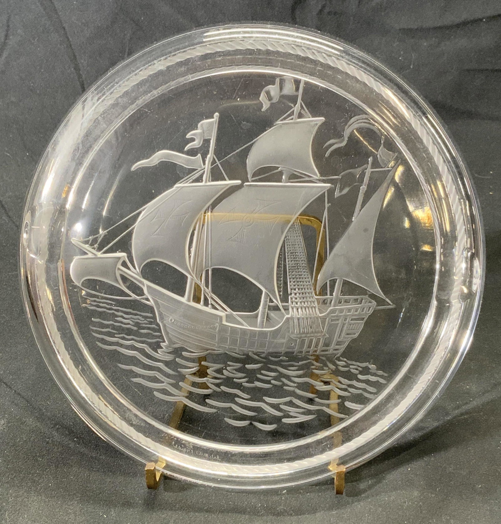 Vintage LALIQUE Crystal Santa Maria Ship Ashtray: Vintage Lalique crystal ashtray with Santa Maria ship motif to center. Trademarked Lalique France etched to underside. Wear to surface consistent wit(age and exposure. Measures approx. 6.75 inches dia