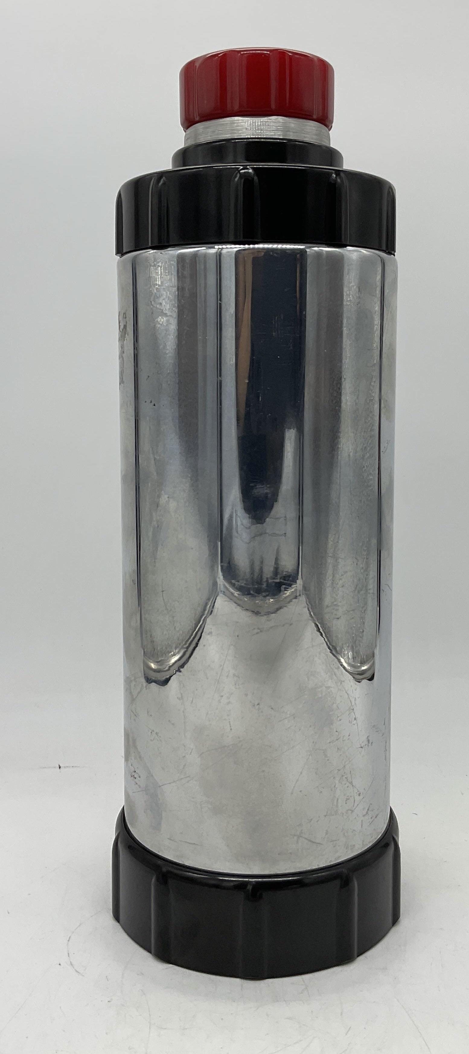 Vintage WEST BEND Cocktail Shaker: Vintage WEST BEND Cocktail Shaker with black Bakelite accents and resin lid, designed by Ralph N Kircher, inscriptions read ‘WB’, ‘Design Pat No 93,928’, measures 11 5/8 inches tall x 4 inches