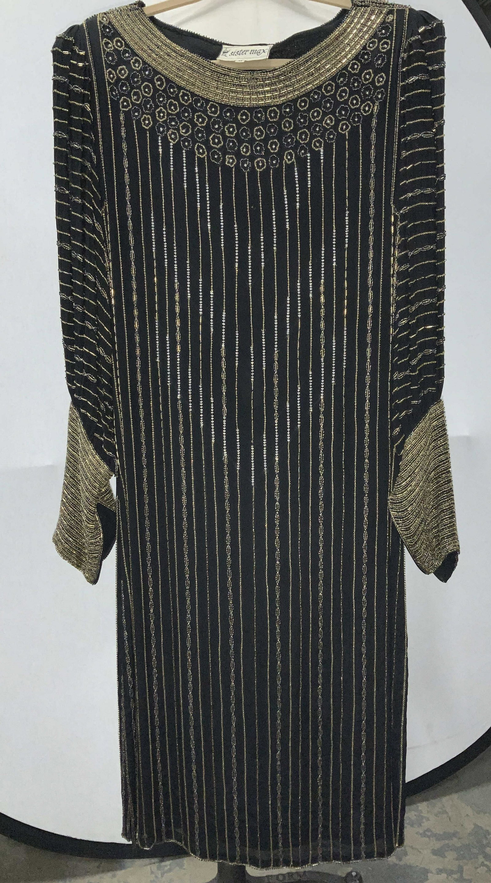 SISTER MAX Art Deco Silk Beaded Dress w Belt: Black silk dress, lined body, sheer sleeves. Heavily beaded in gold and rainbow seed beads along cuffs, and vertical design down body of dress. Labeled Sister Max size medium. Thin shoulder pads, side