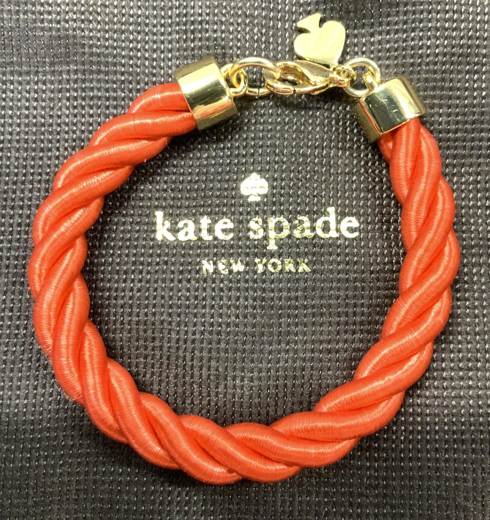 Kate Spade Orange Rope Bracelet in Duster bag (1 of 4)