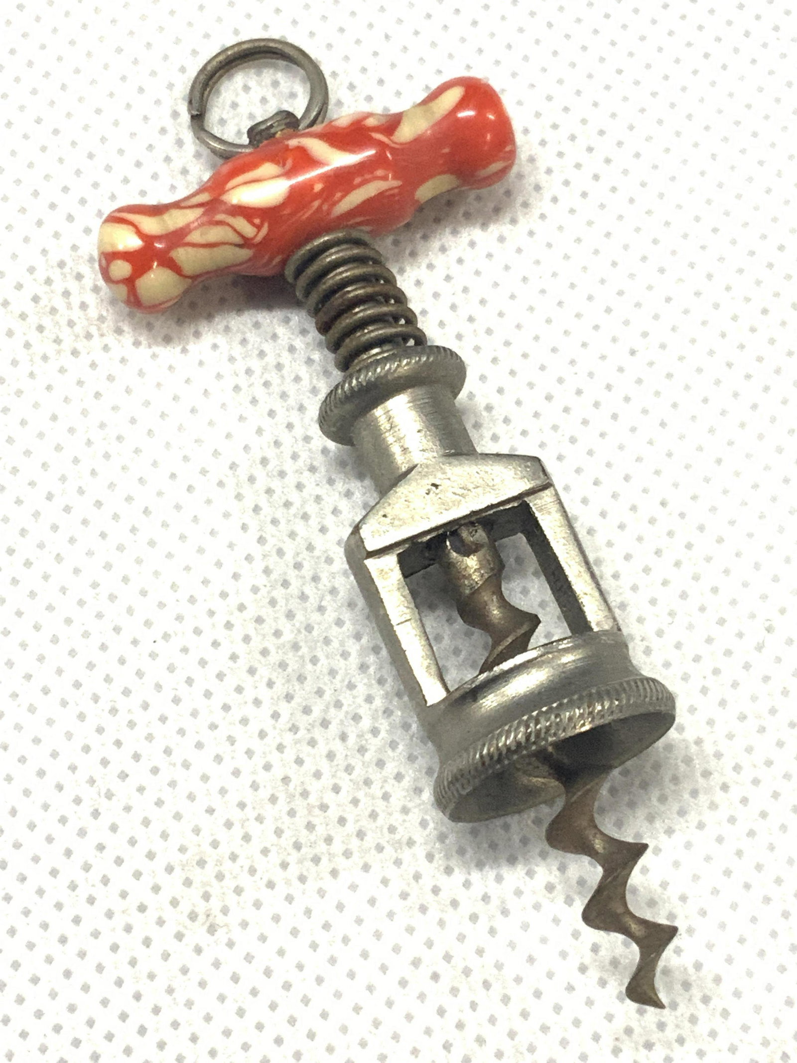 Vintage Miniature Metal Wine Bottle Opener: Metal made miniature wine bottle with beaded top handle. Approximately 3 inches long. Condition is consistent with vintage age and use. Vintage miniature accessories, miniature accessories, doll acces